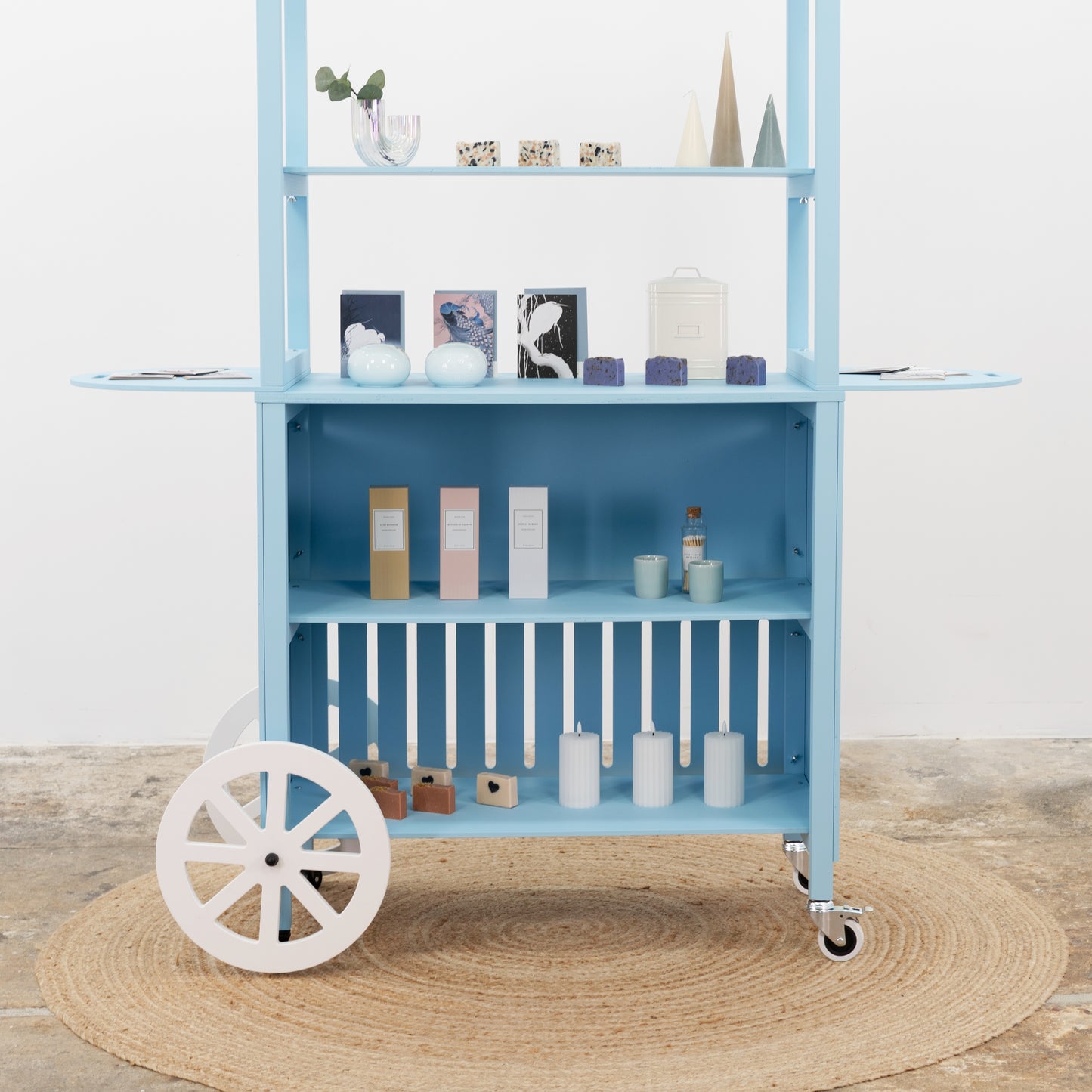 Blue vendor cart with full product shelf – promotional booth for fairs