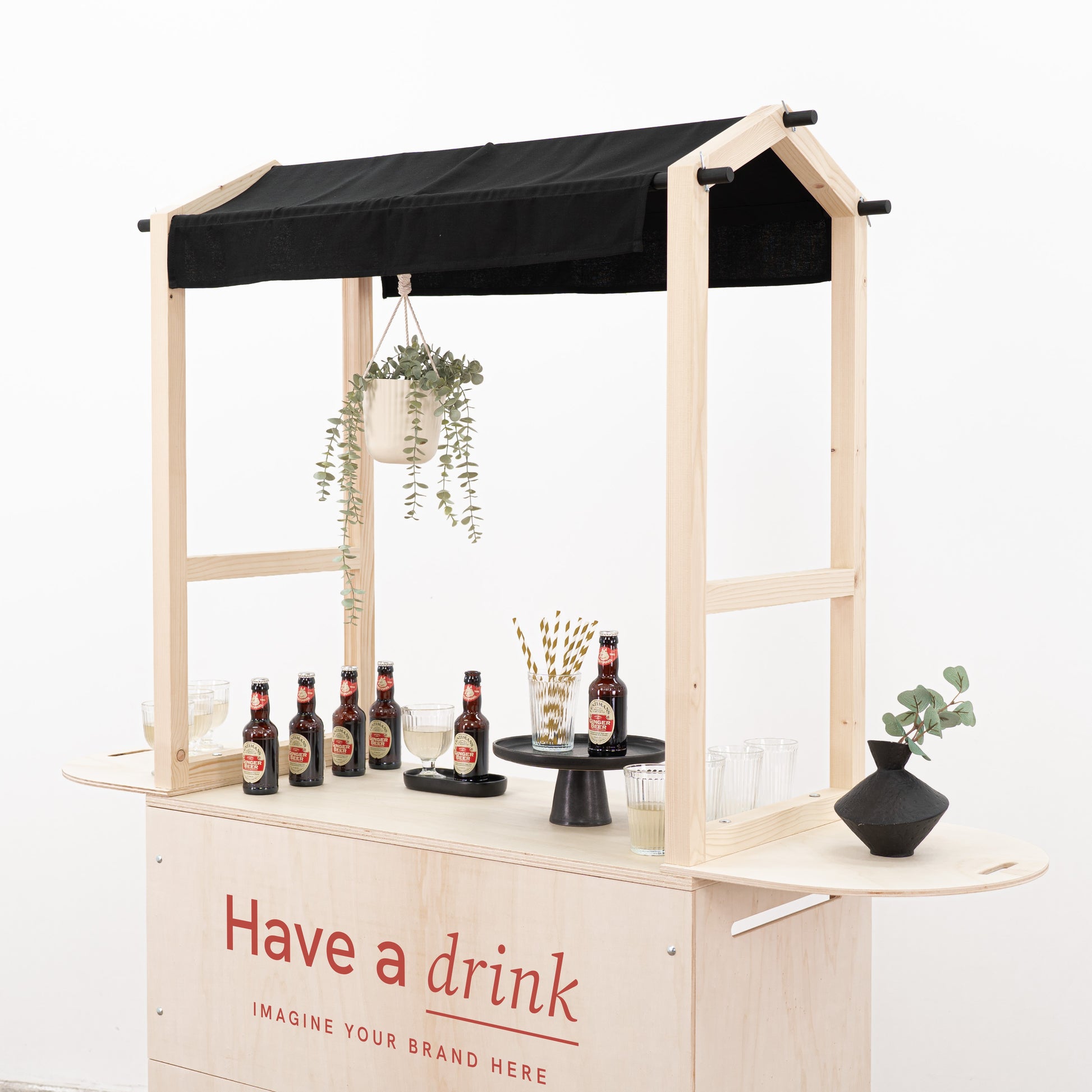 Custom event cart with black fabric awning and natural wood finish