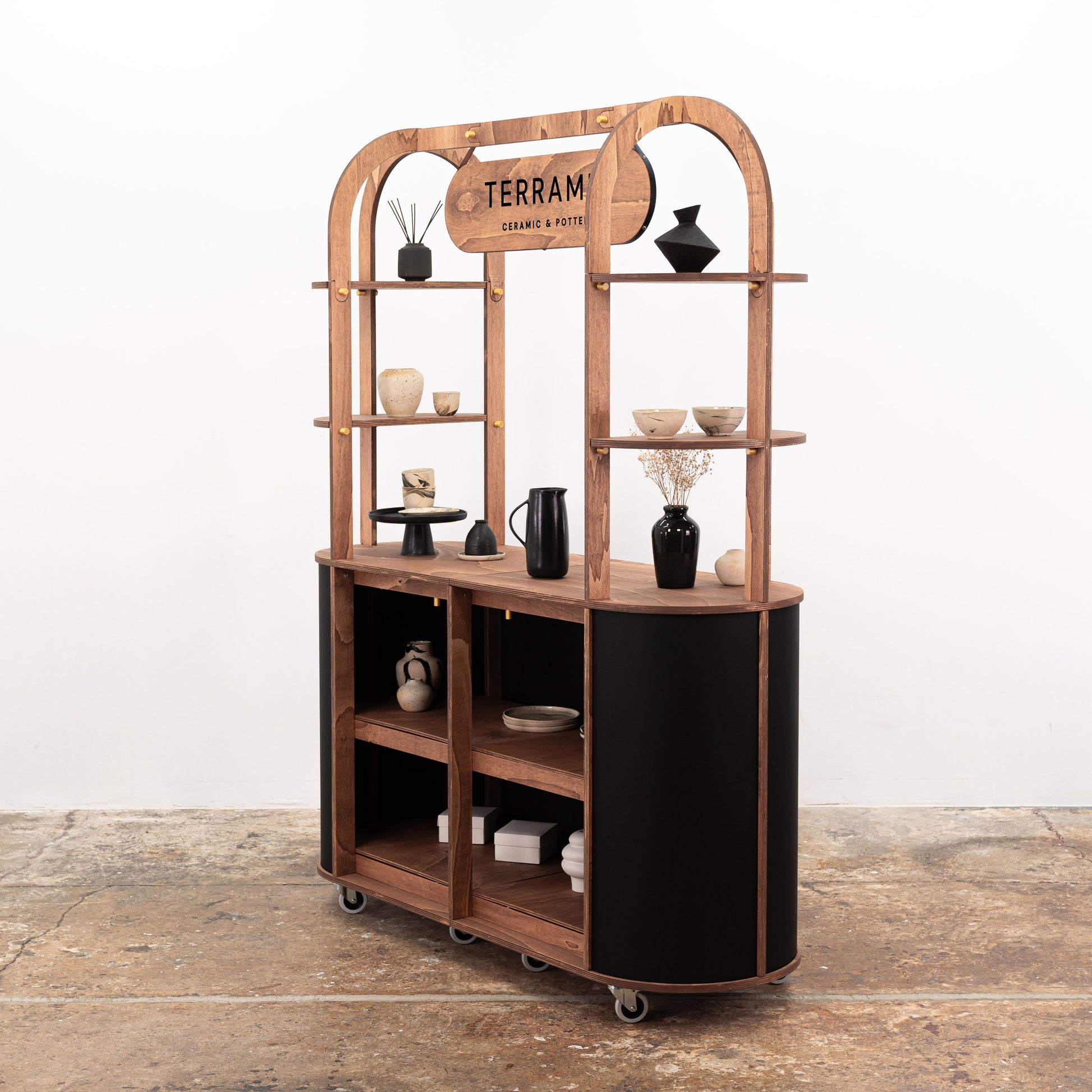 The VC-29 cart used at a trade show booth, showcasing its adaptability for both beverage service and product displays.
