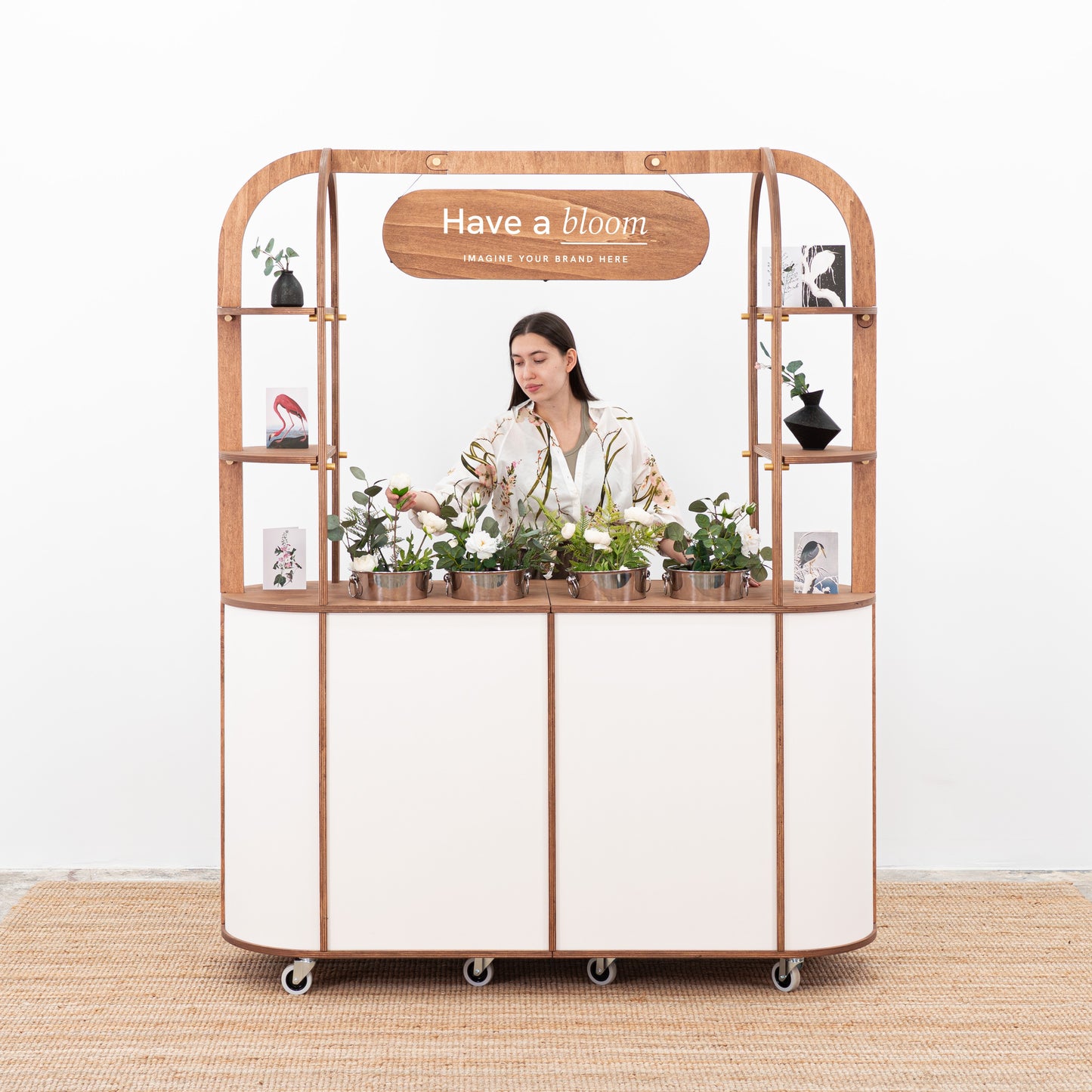 Flower cart with coolers to keep floral arrangements hydrated during events and weddings.