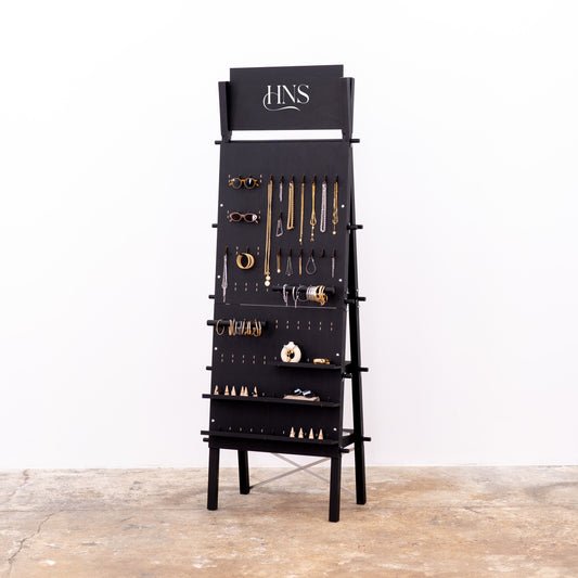 Matte black A-frame pegboard display stand with hooks
