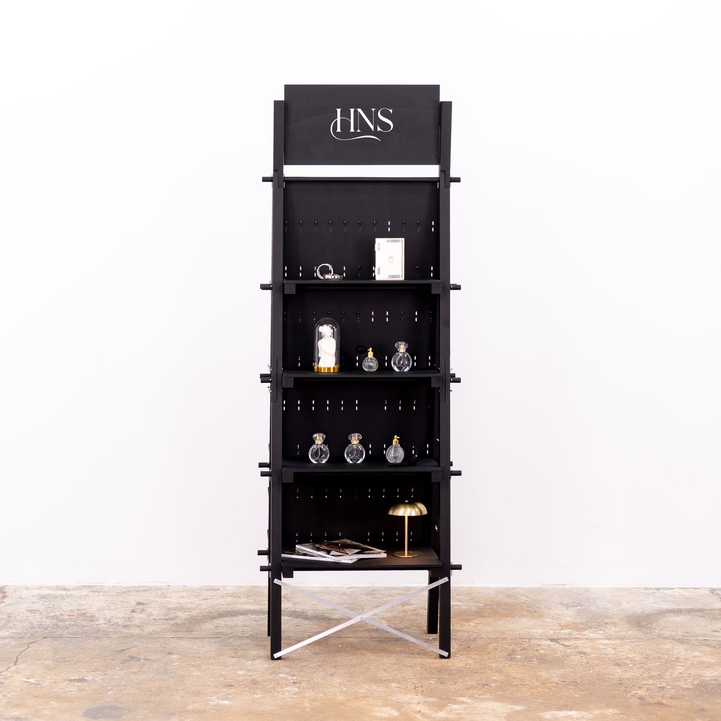 Compact black pegboard for mobile pop-up retail spaces