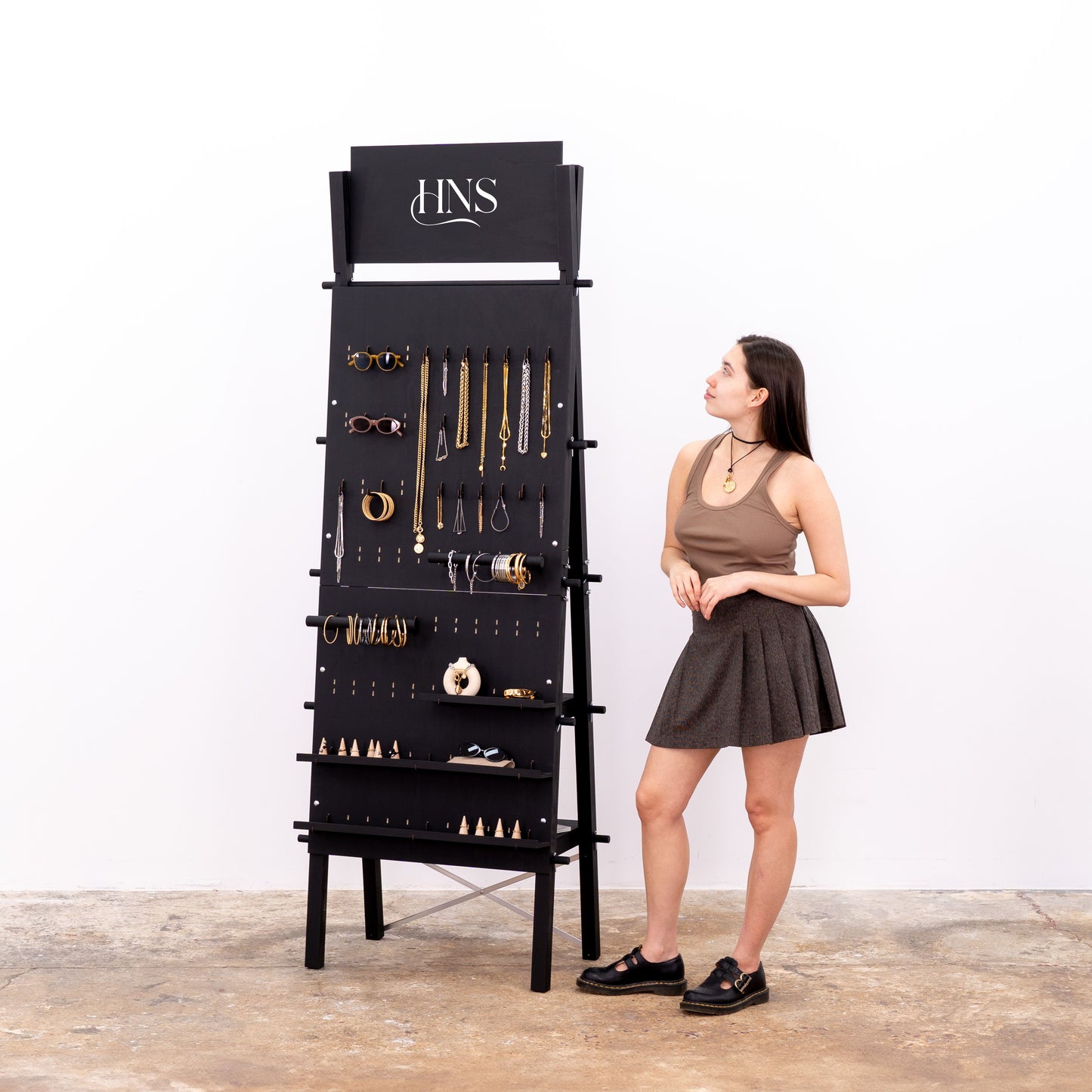 Freestanding pegboard display with customizable top branding panel