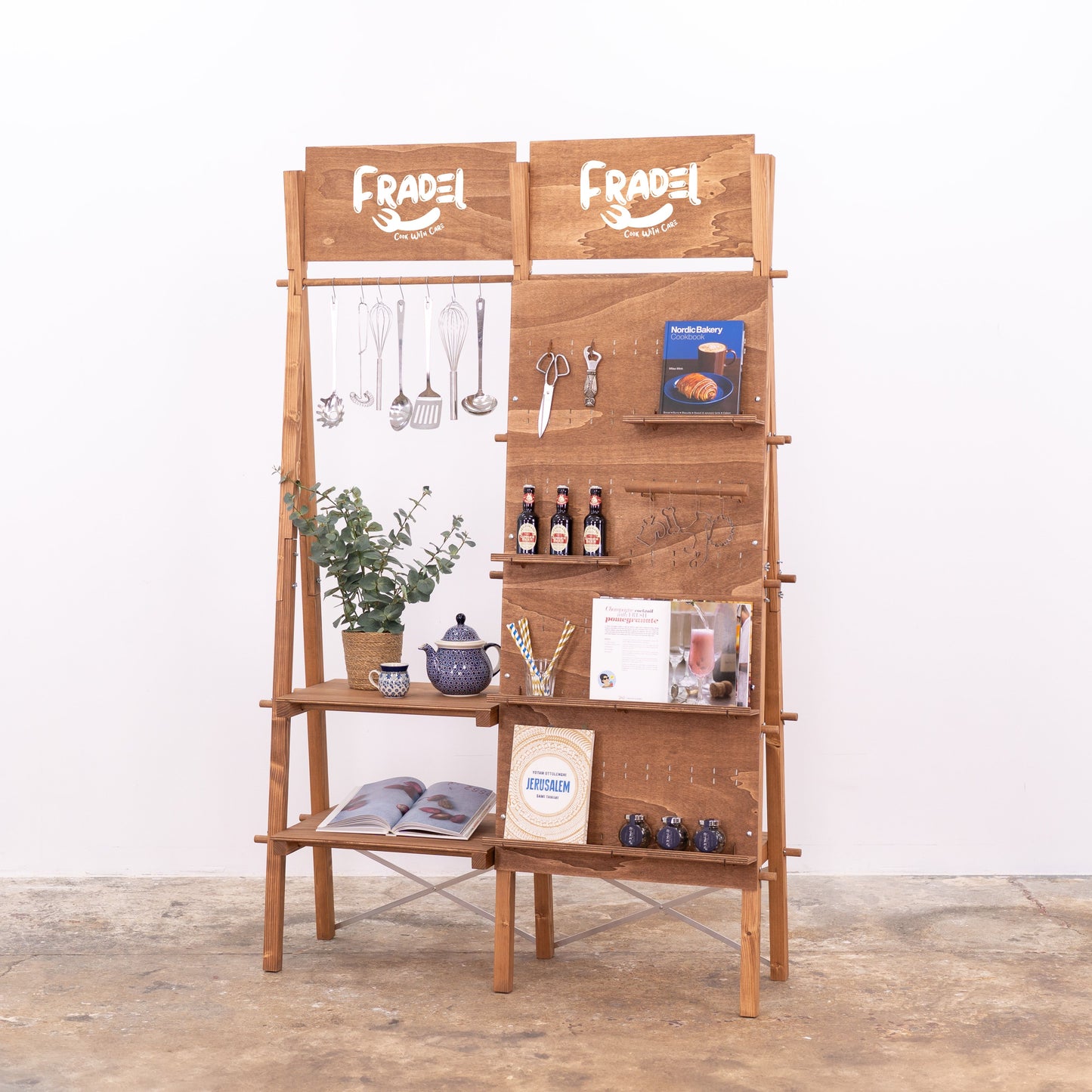 Portable retail stand in coffee finish with rail for decor and signage