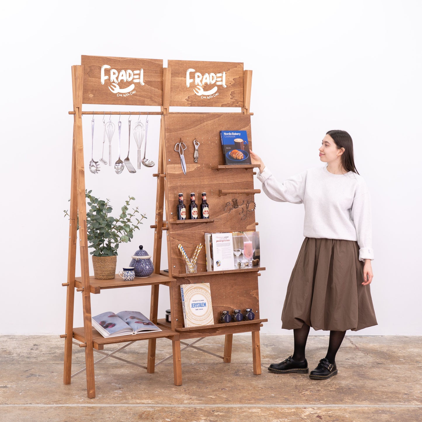 Dual-sided wooden retail display in coffee color with pegboard and shelving
