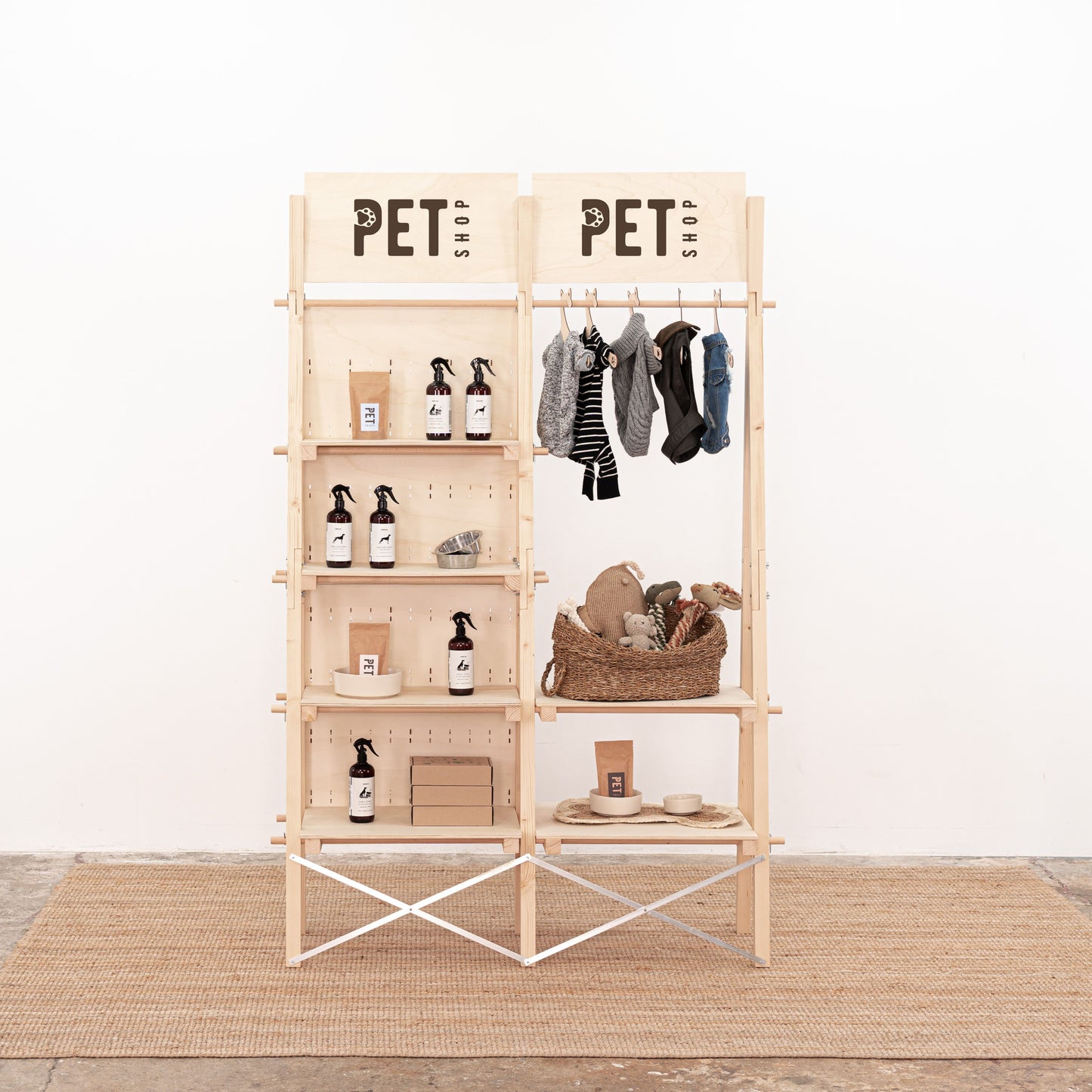 Wooden retail display stand with shelves and garment rod for pop-up shops