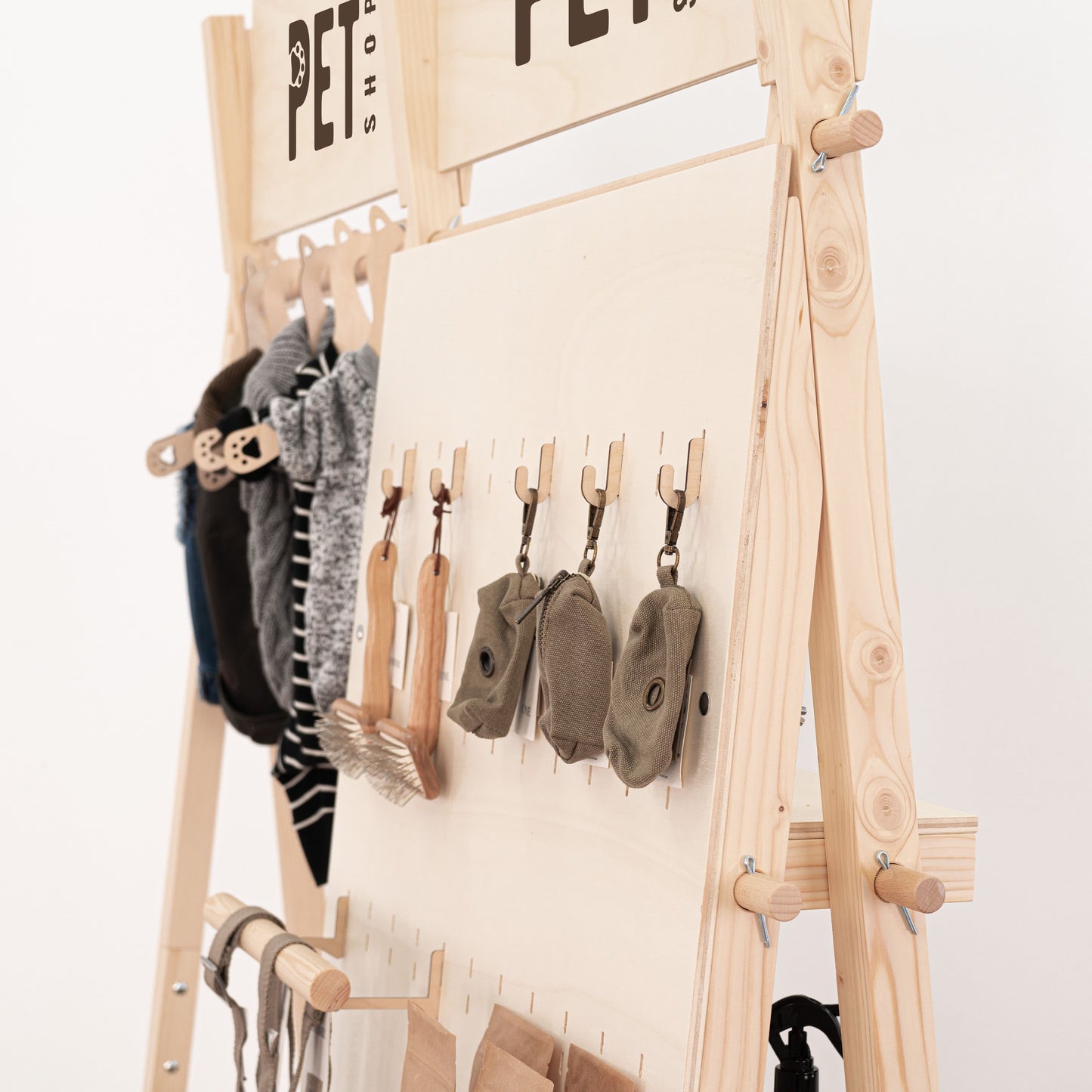 Natural wood retail rack for showcasing clothing and accessories at pop-up stores