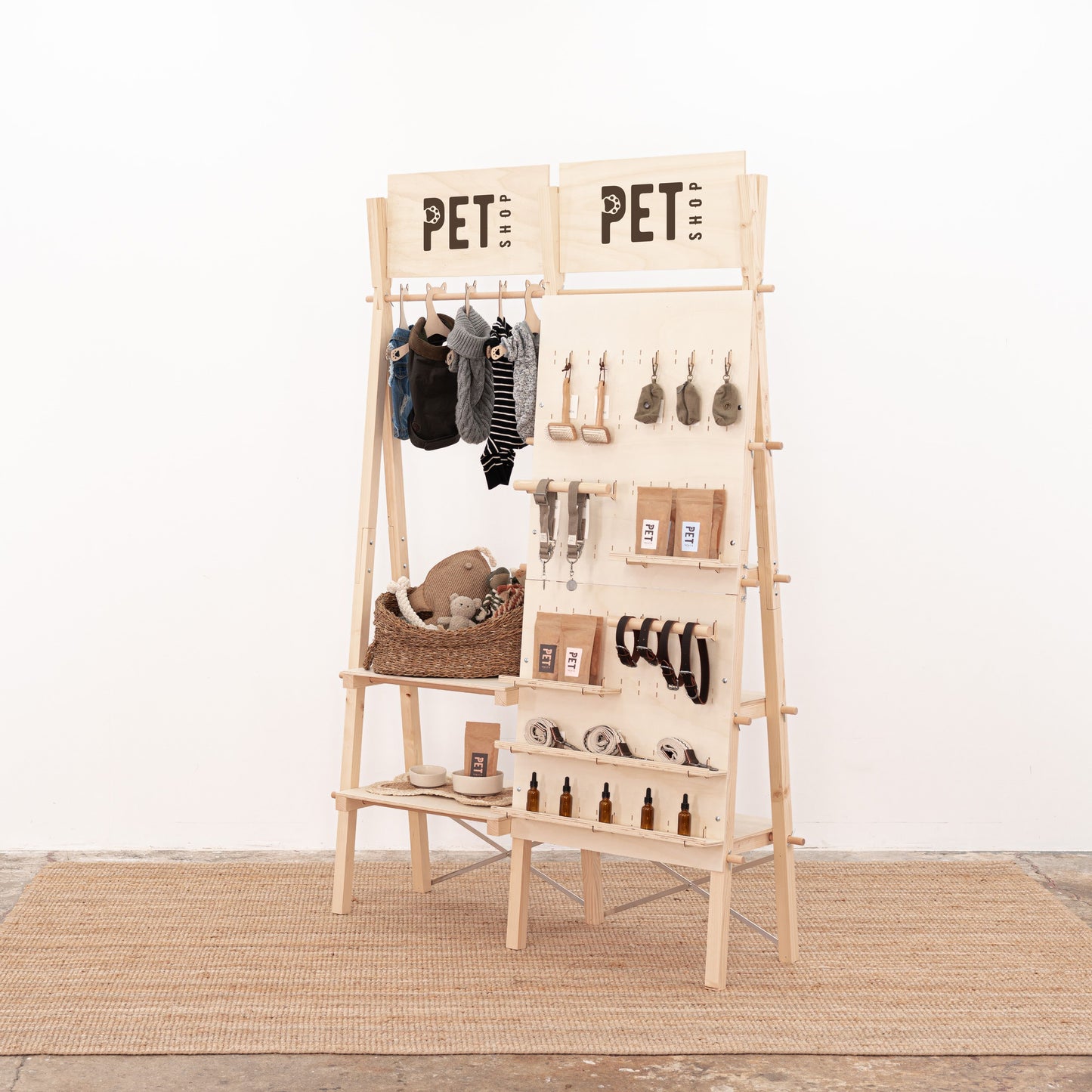 Portable display rack combining shelving, pegboard, and clothing rail