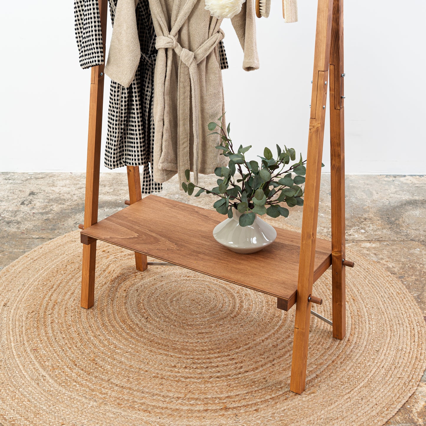 Clothing rack with wooden dowels and branded top panel – coffee color