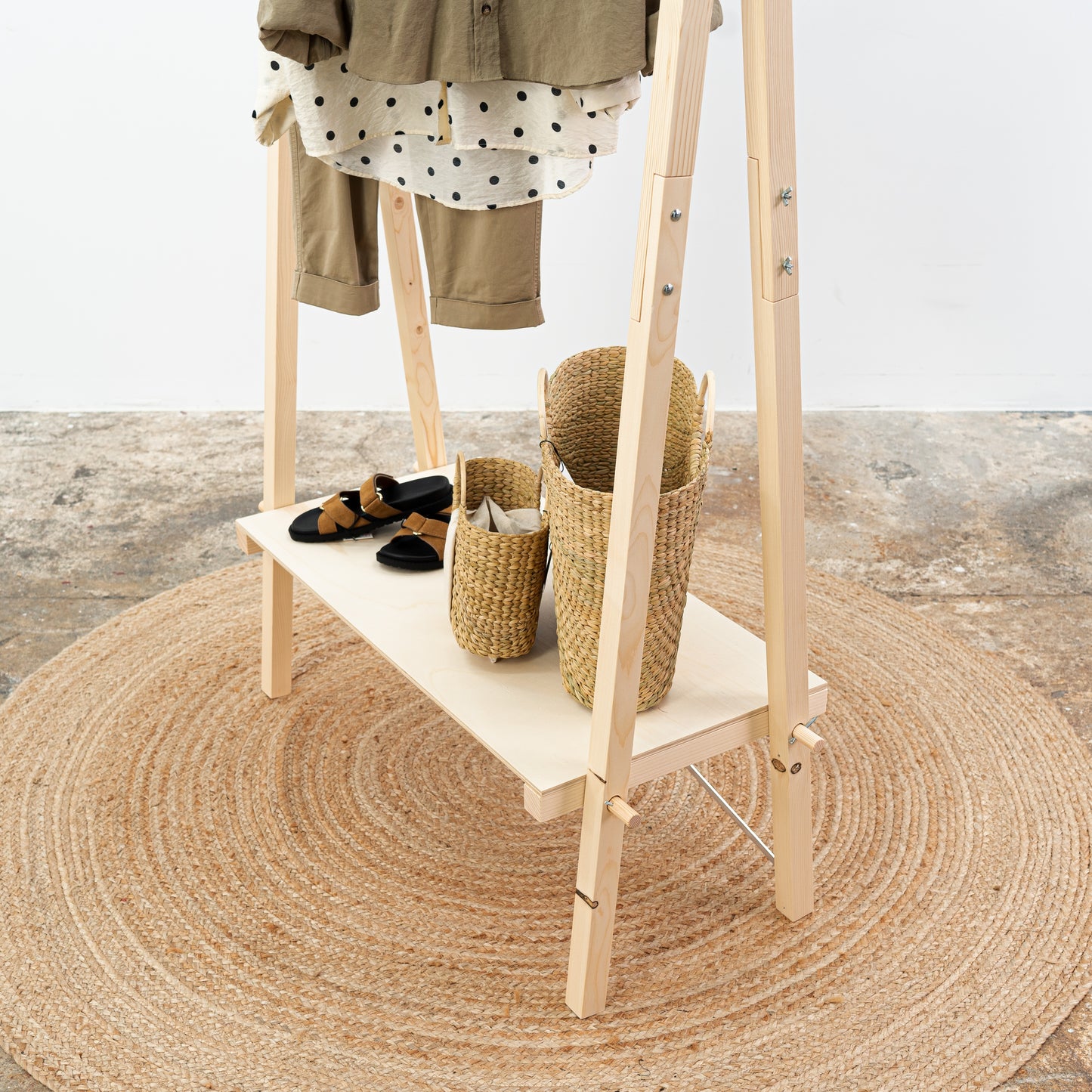 Foldable wooden fashion display with warm neutral styling