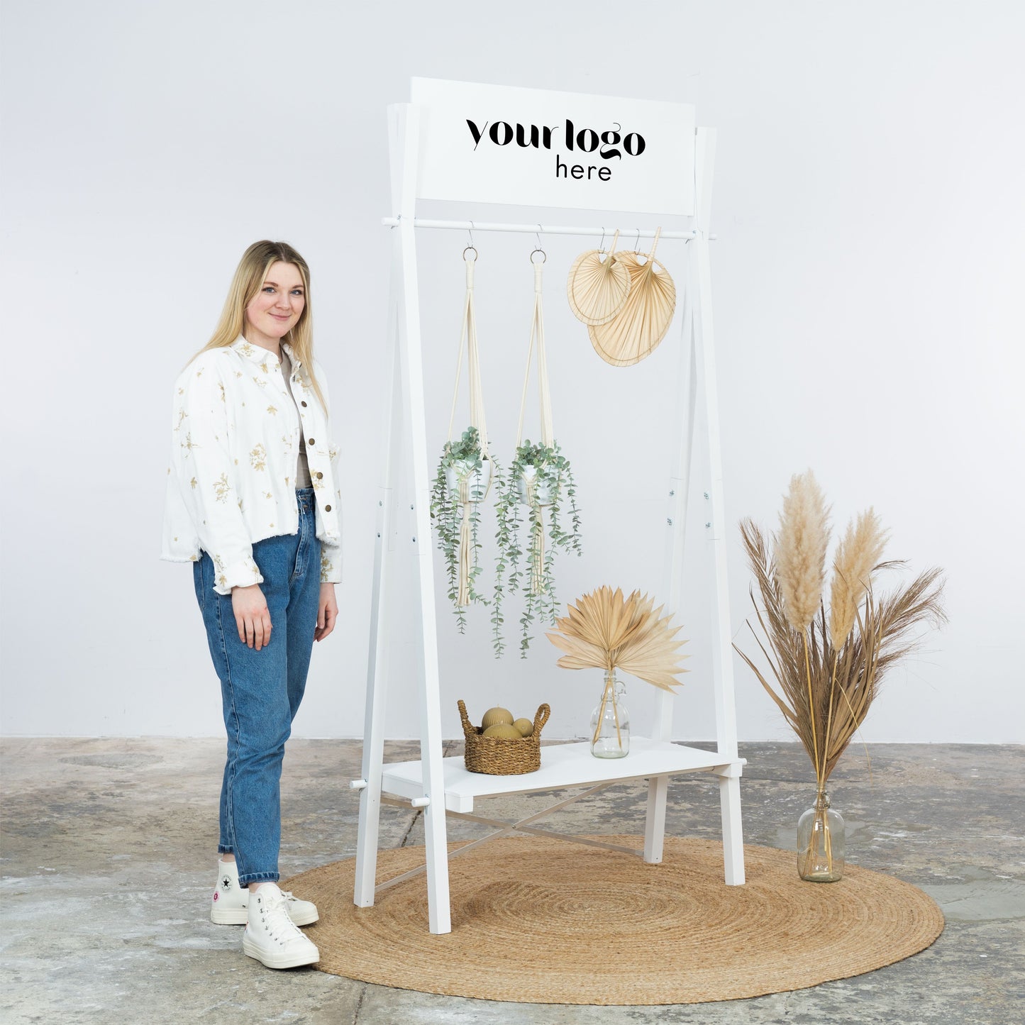 White rack with robe, slippers and styled shelf display