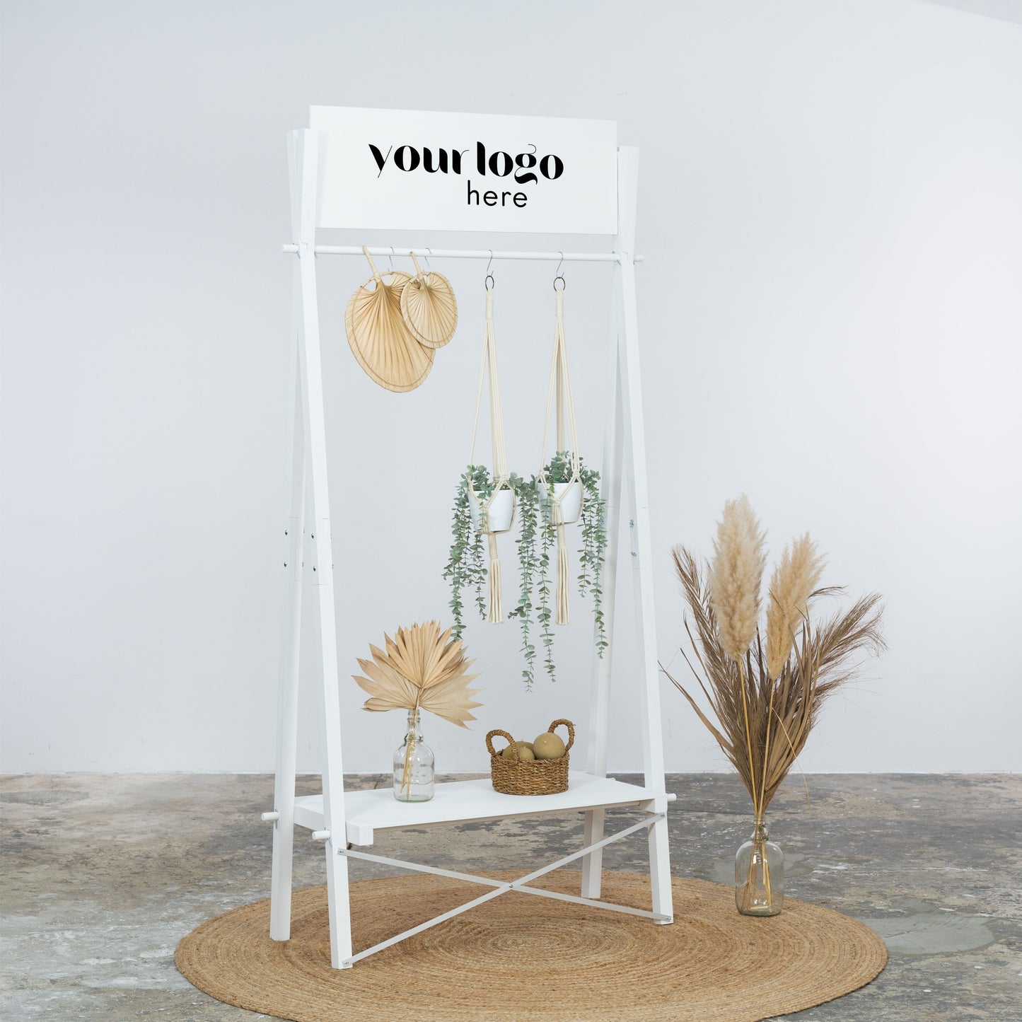 White foldable clothes display stand with branding panel