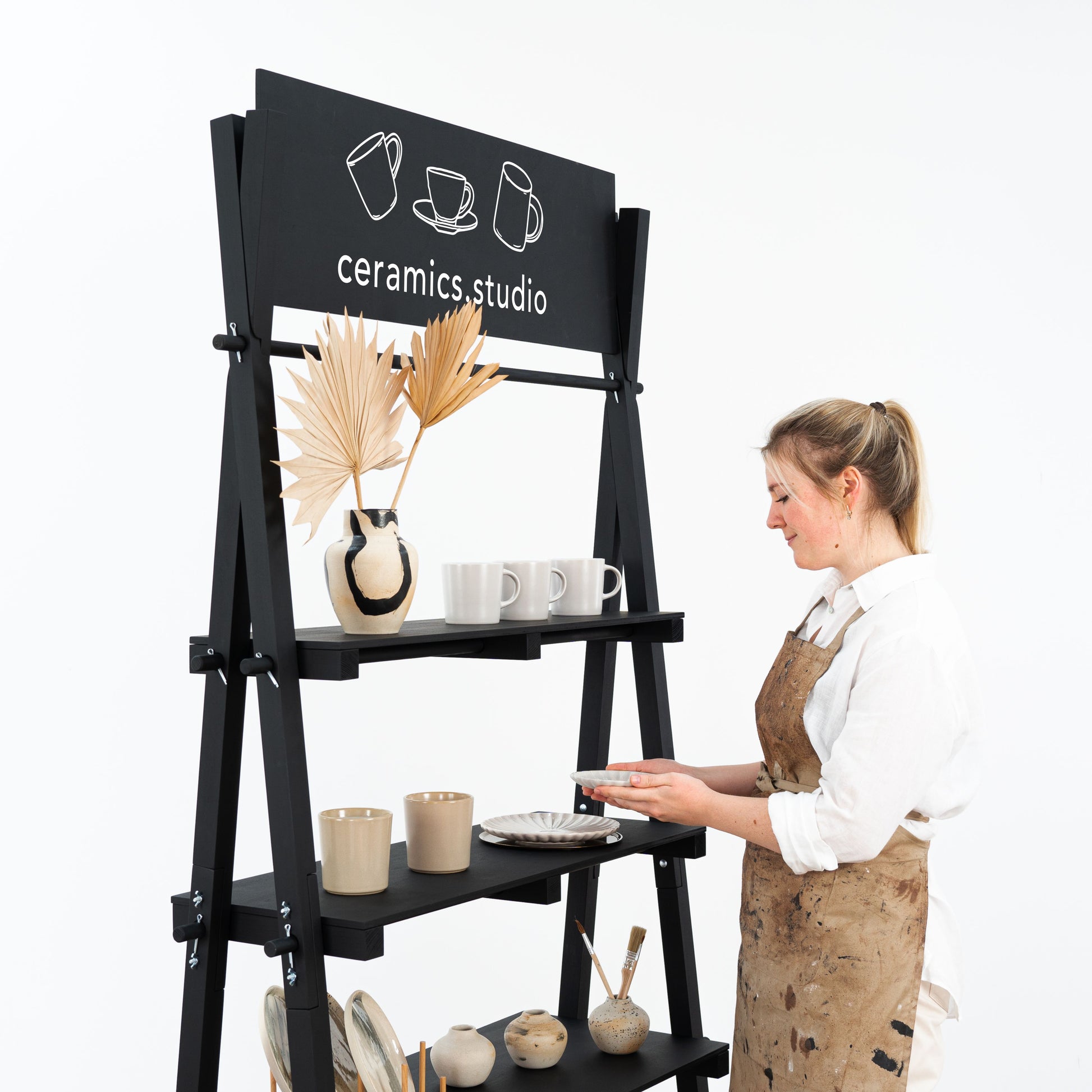 Portable black wooden shelving unit for vendors and pop-up market booths