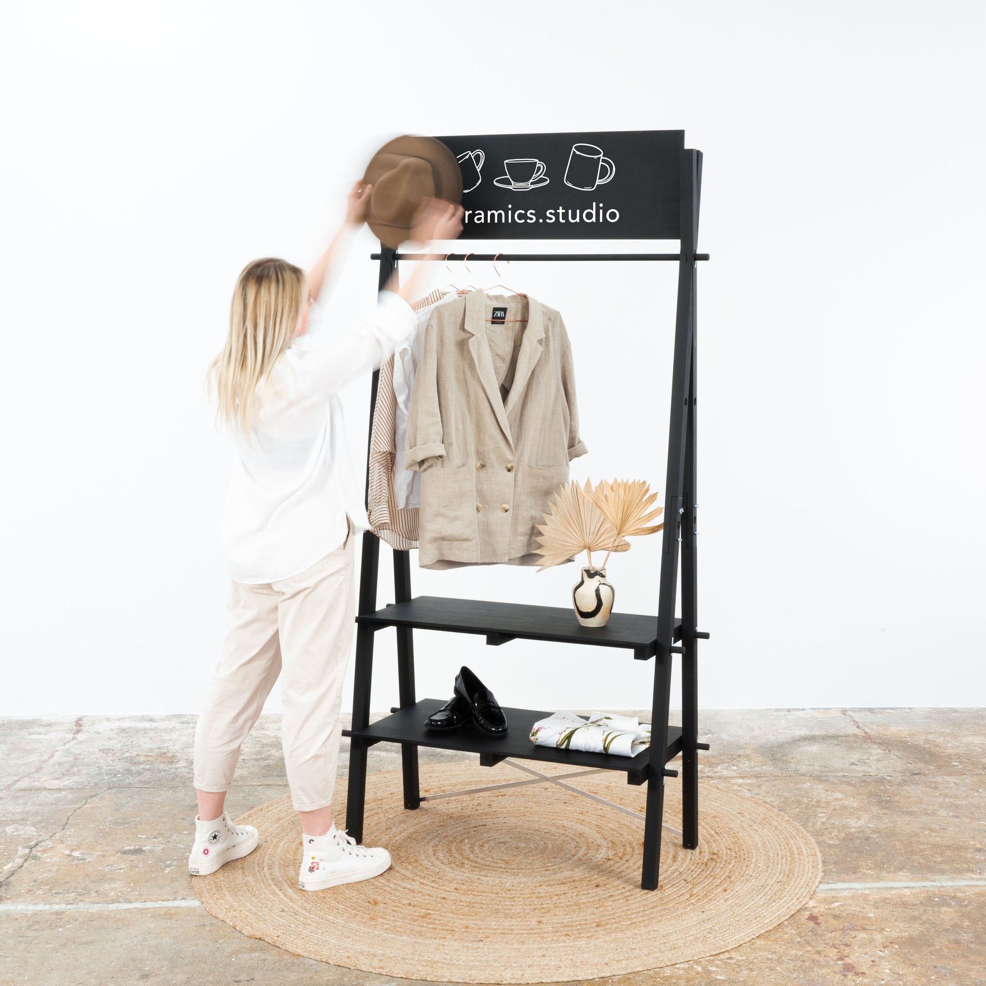 Contemporary black event shelving with adjustable slanted shelves for retail showcases