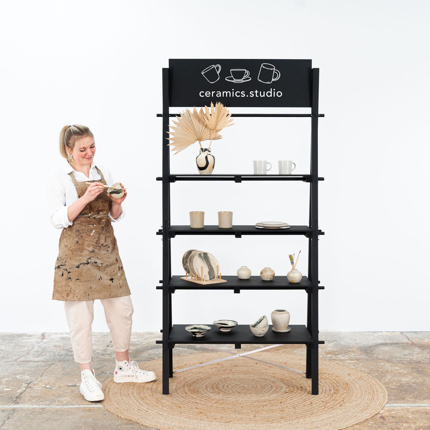 Black A-frame collapsible shelving unit for modern retail displays