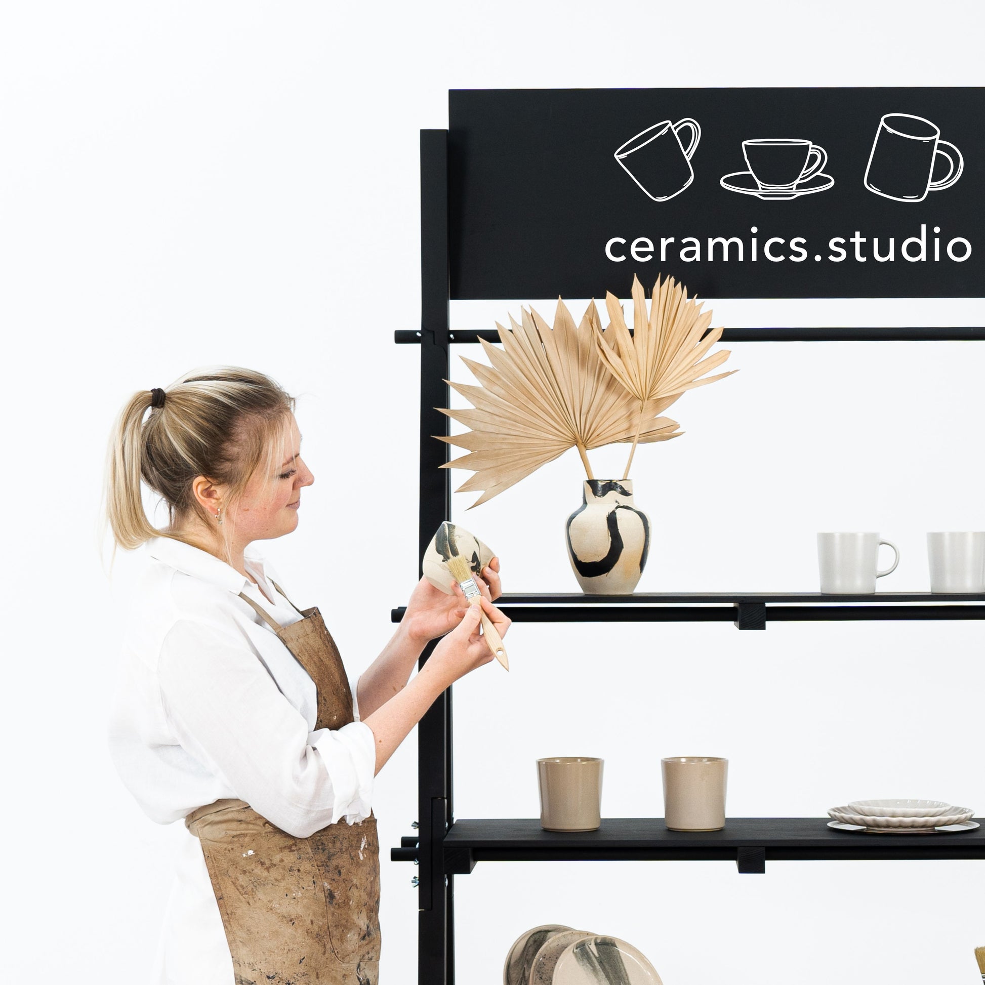 Minimalist black shelving unit with vertical A-frame design for premium product displays