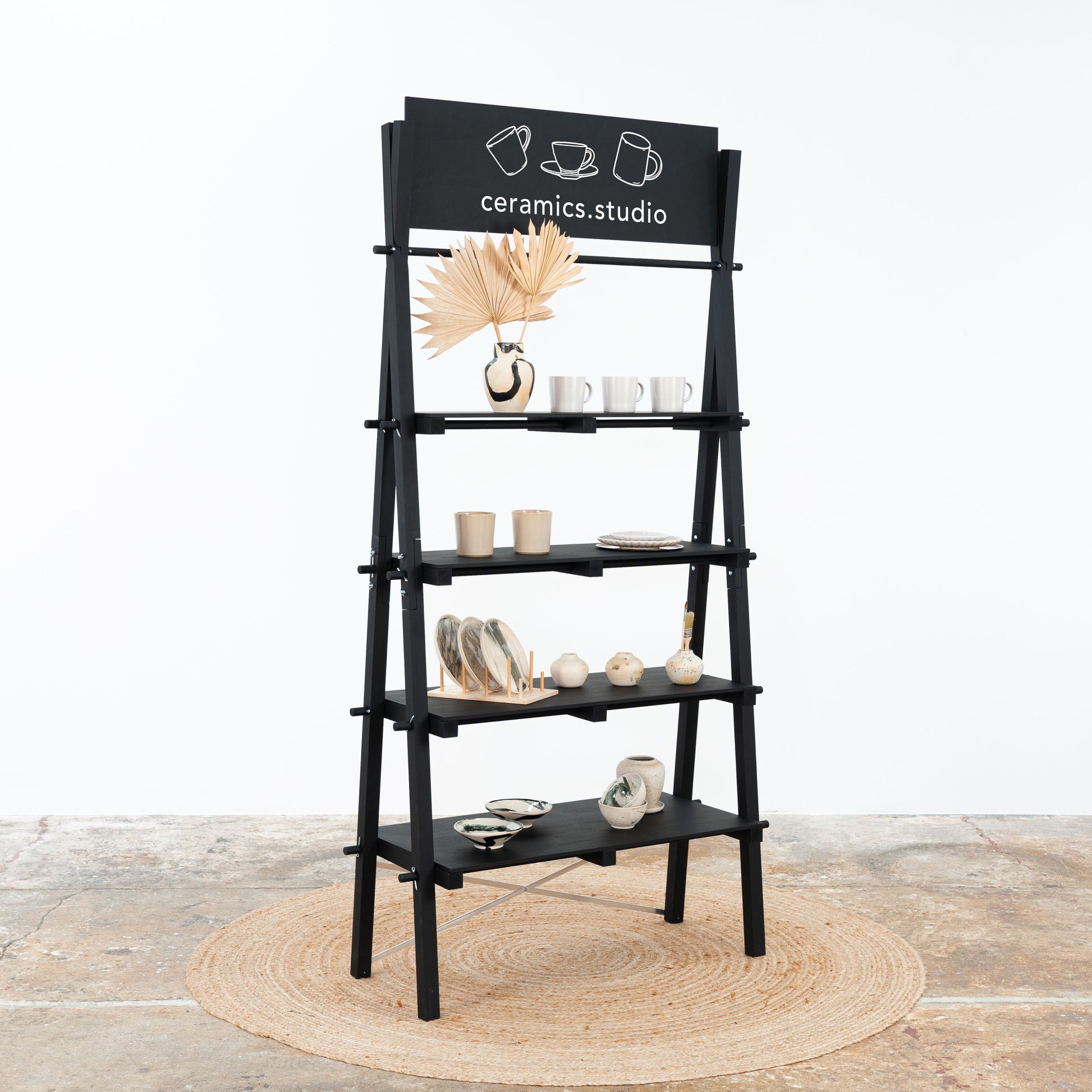 Foldable black display shelf for trade shows, exhibitions, and pop-up shops