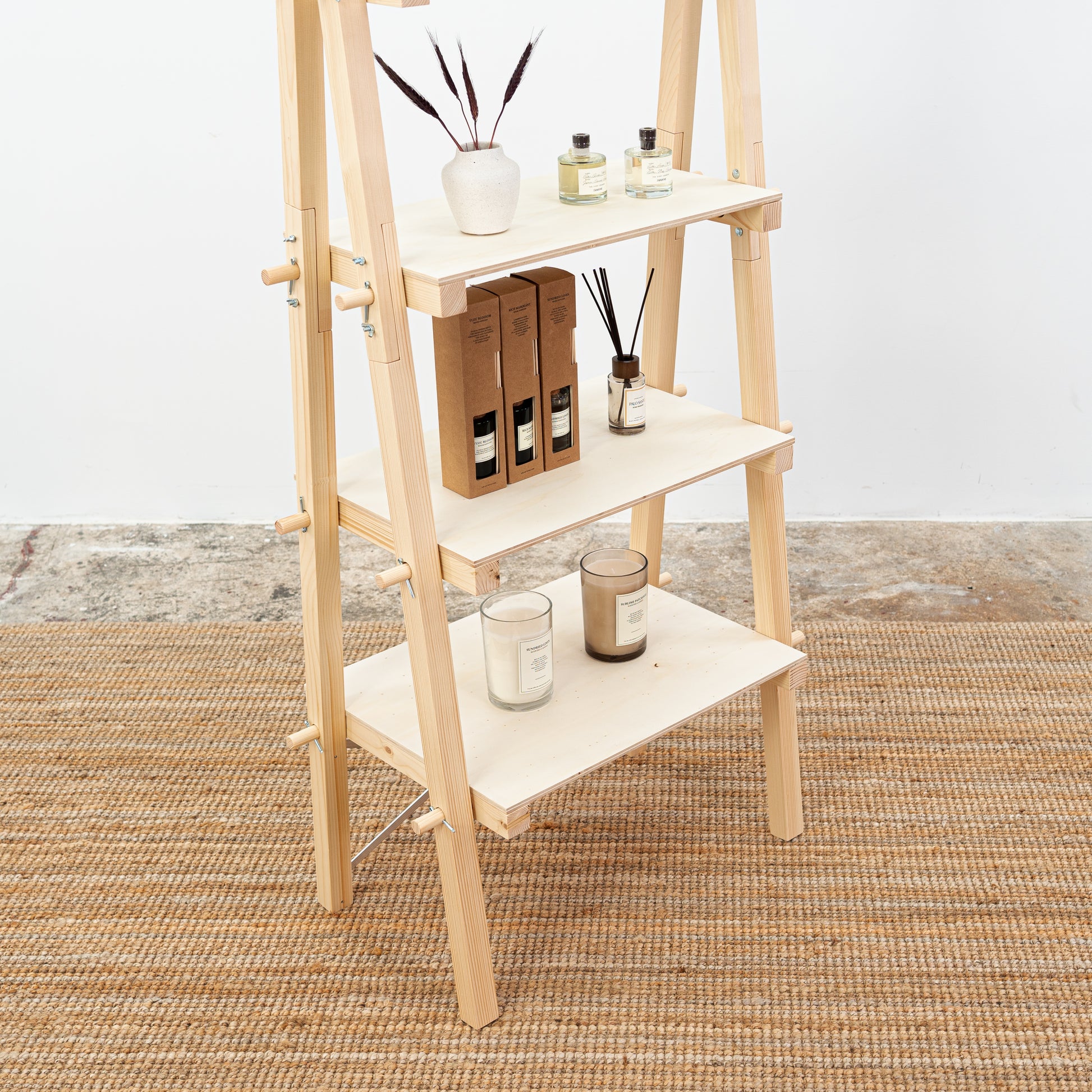 Portable wooden stand for showcasing home accessories and wellness products