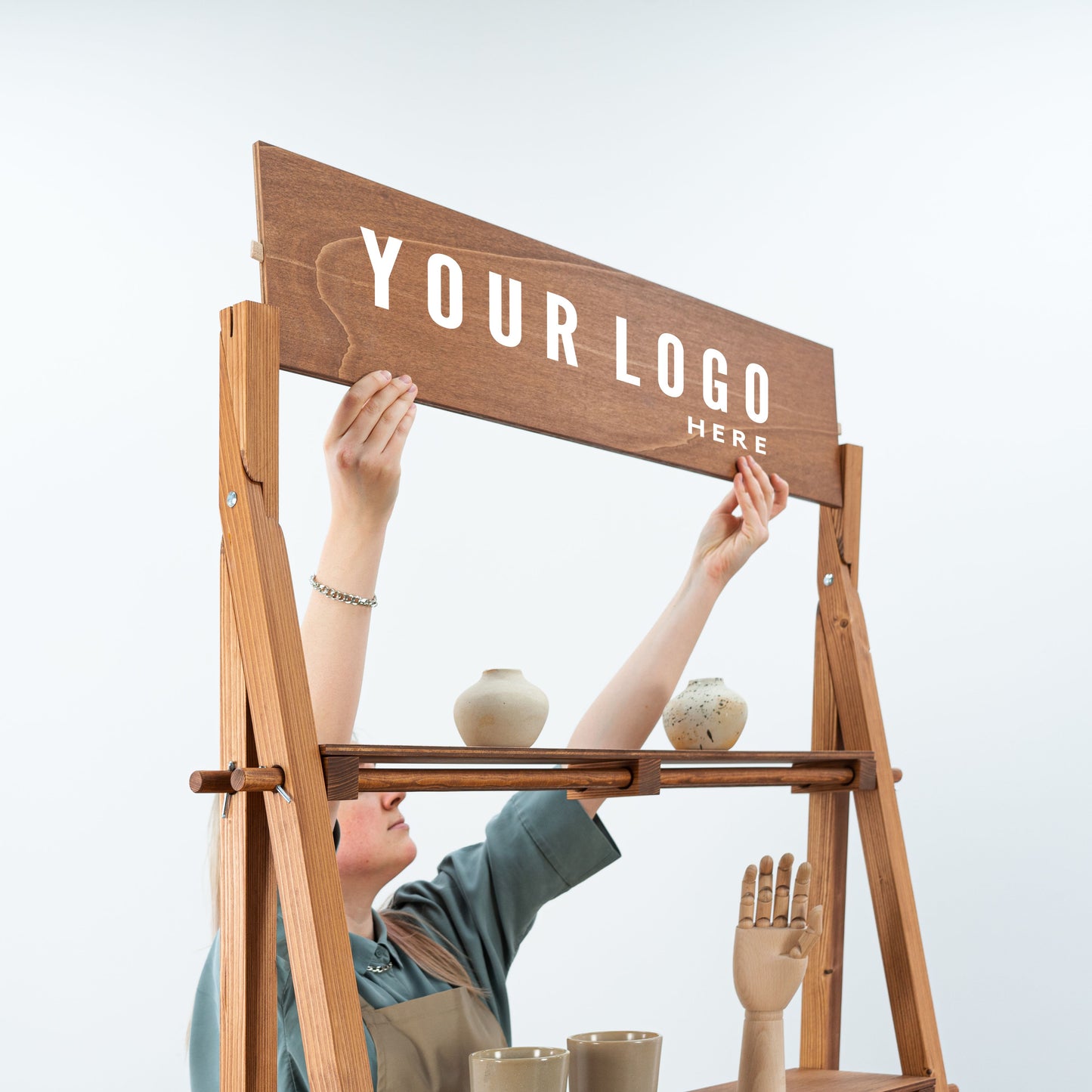 Portable slanted shelving in rich brown wood for boutique exhibitions