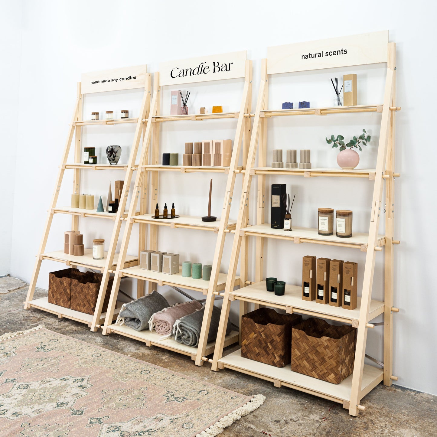 Lightweight, foldable display shelves with a modern slanted wood design for retail and events.