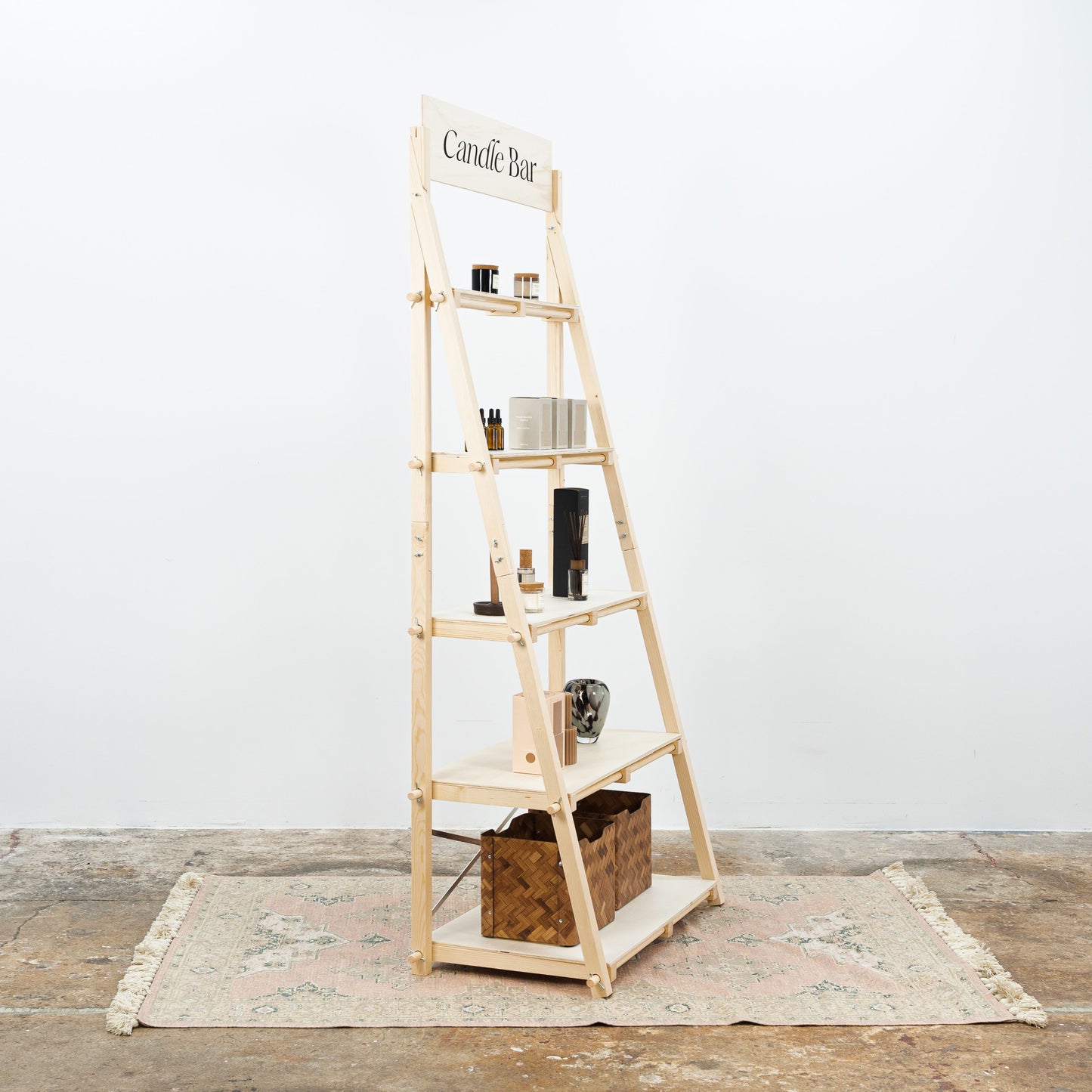 Collapsible market shelving unit with modular wooden shelves for vendor booths and exhibitions.