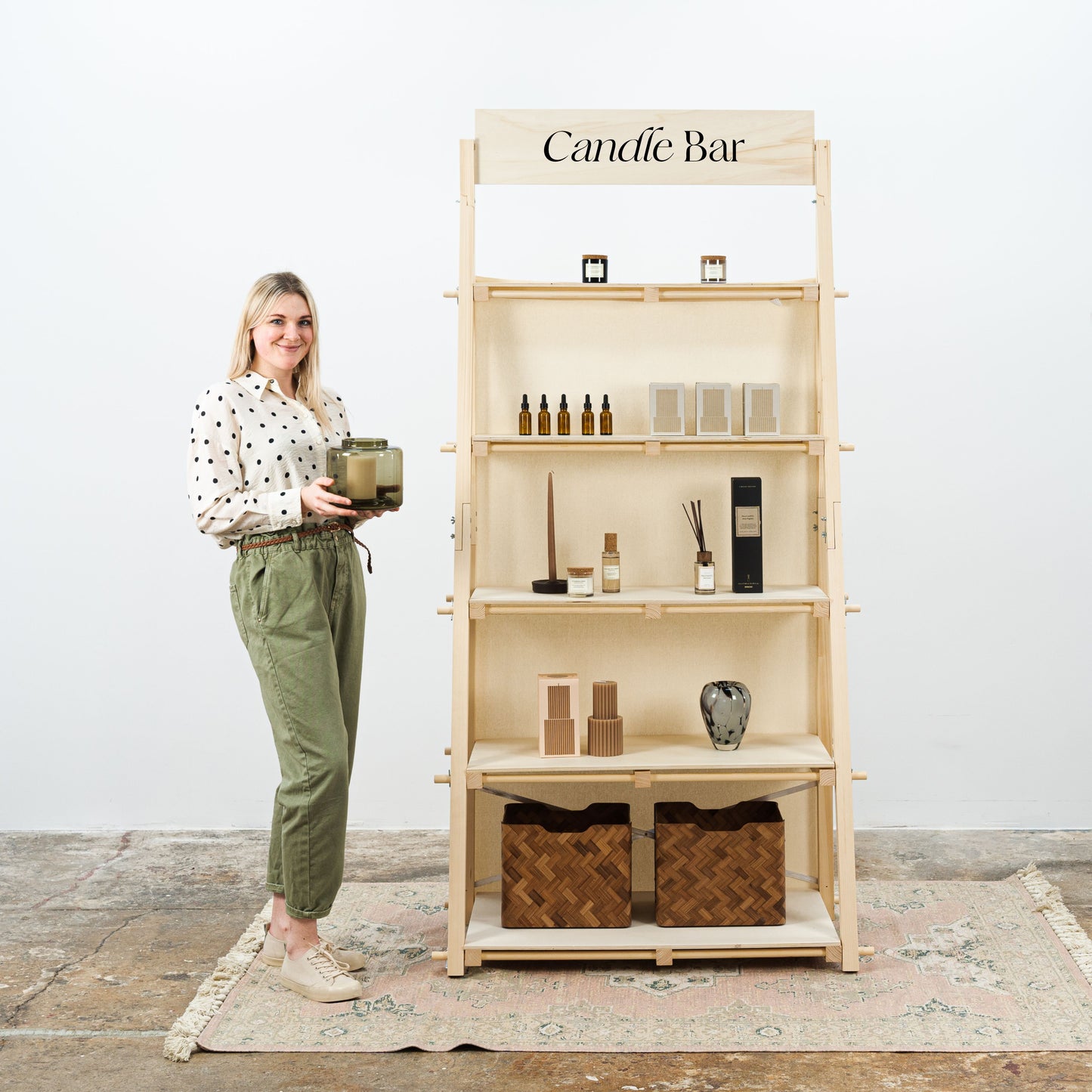 Portable wooden shelving unit for trade shows, easy-to-assemble and collapsible design.