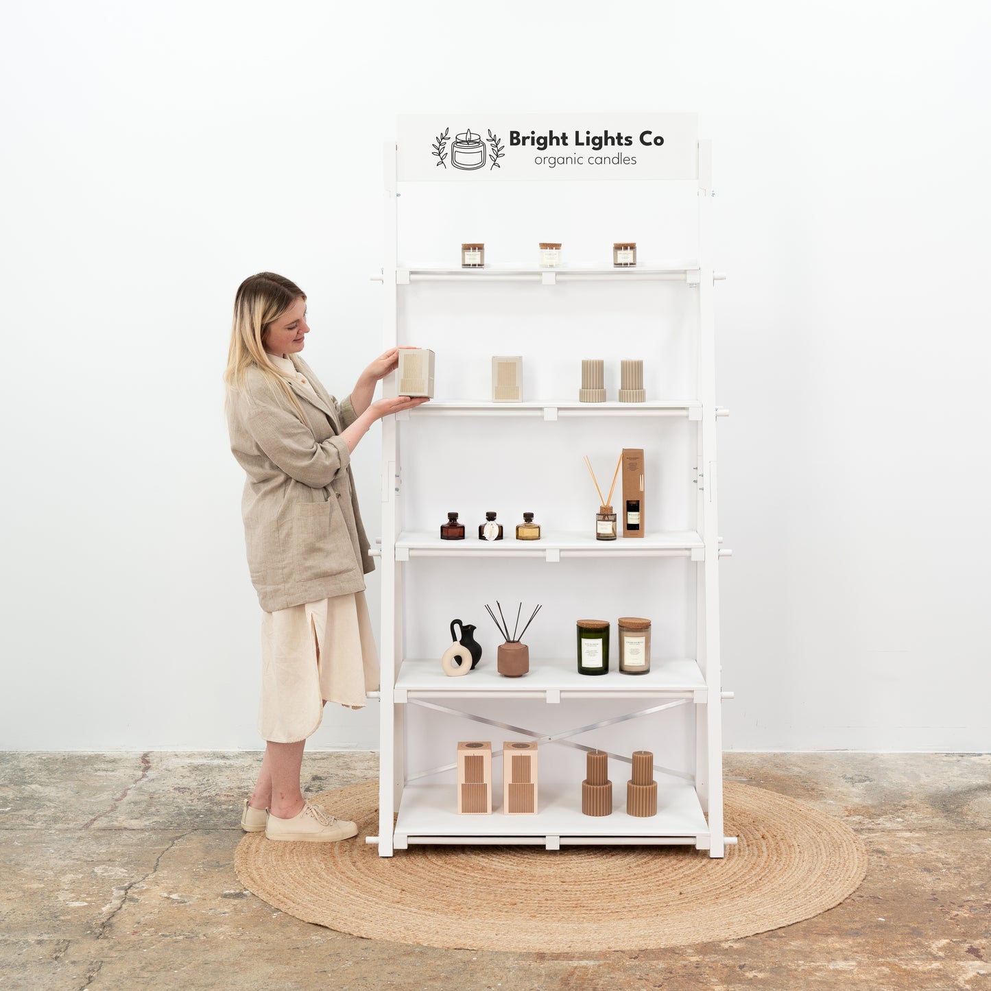 White flat-pack display shelves with lightweight structure and eco-friendly finish