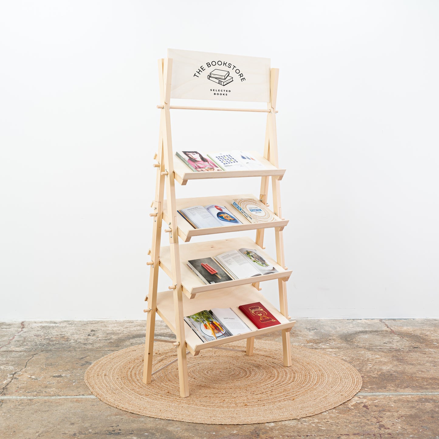 Pop-up display with natural finish shelf styled with lifestyle and home accessories