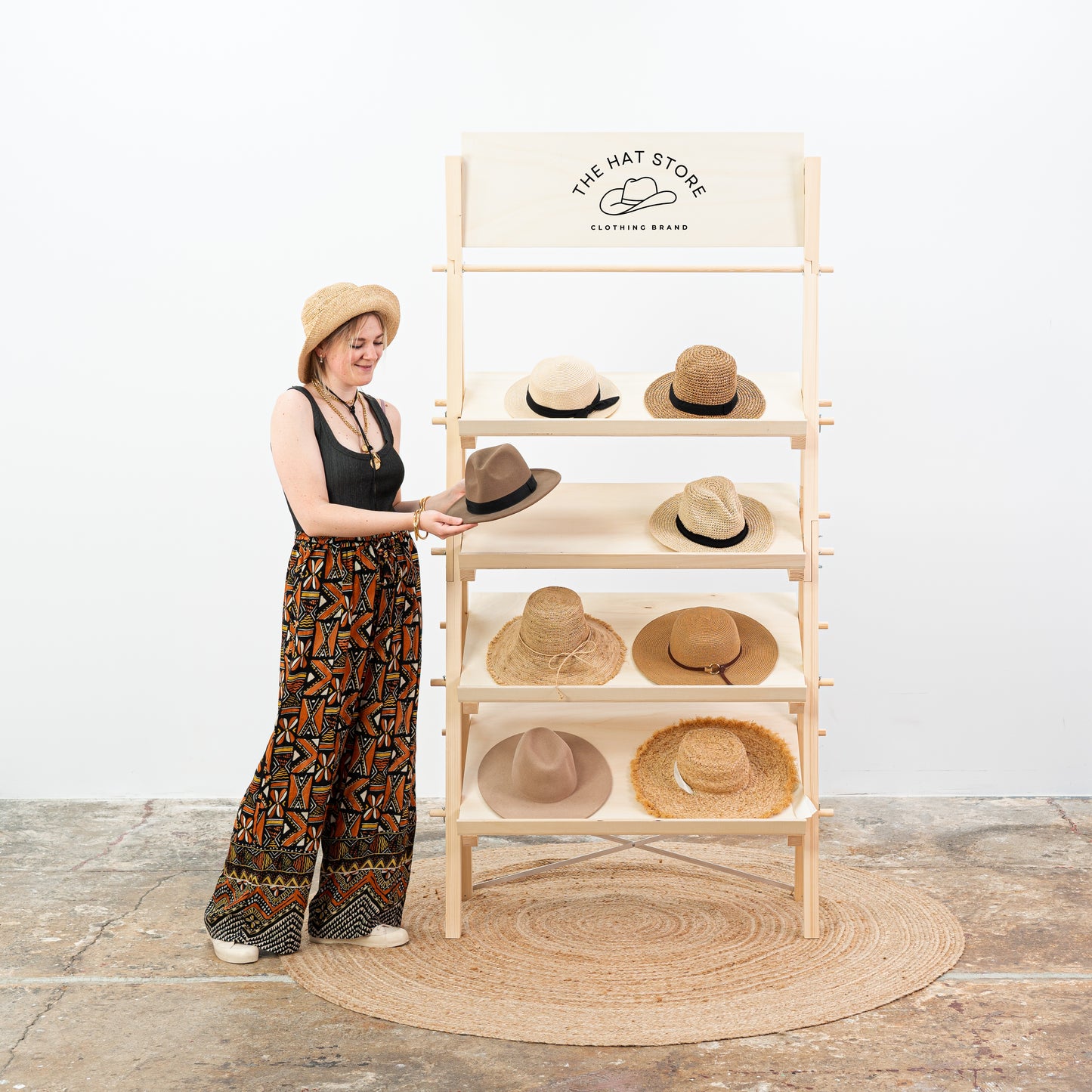 Event booth setup featuring customizable wooden shelving for home decor