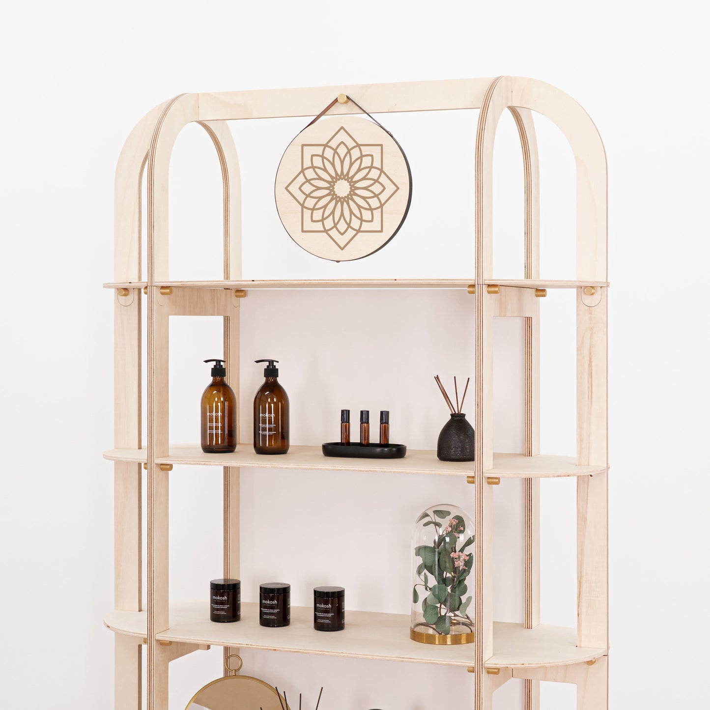 Portable wooden shelf on wheels with apothecary-style cosmetics