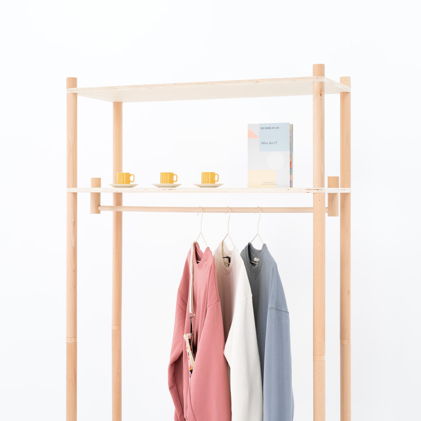 Back view of modular clothing rack with cotton panel