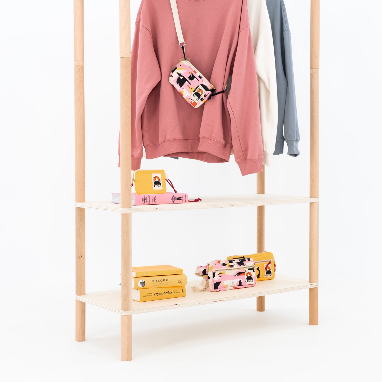 Clothing rack close-up with garments and display shelf