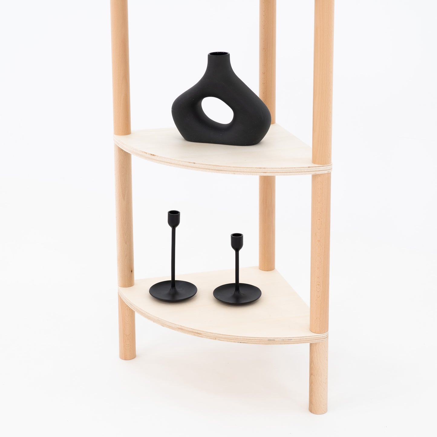 Open corner display shelf with black ceramic products