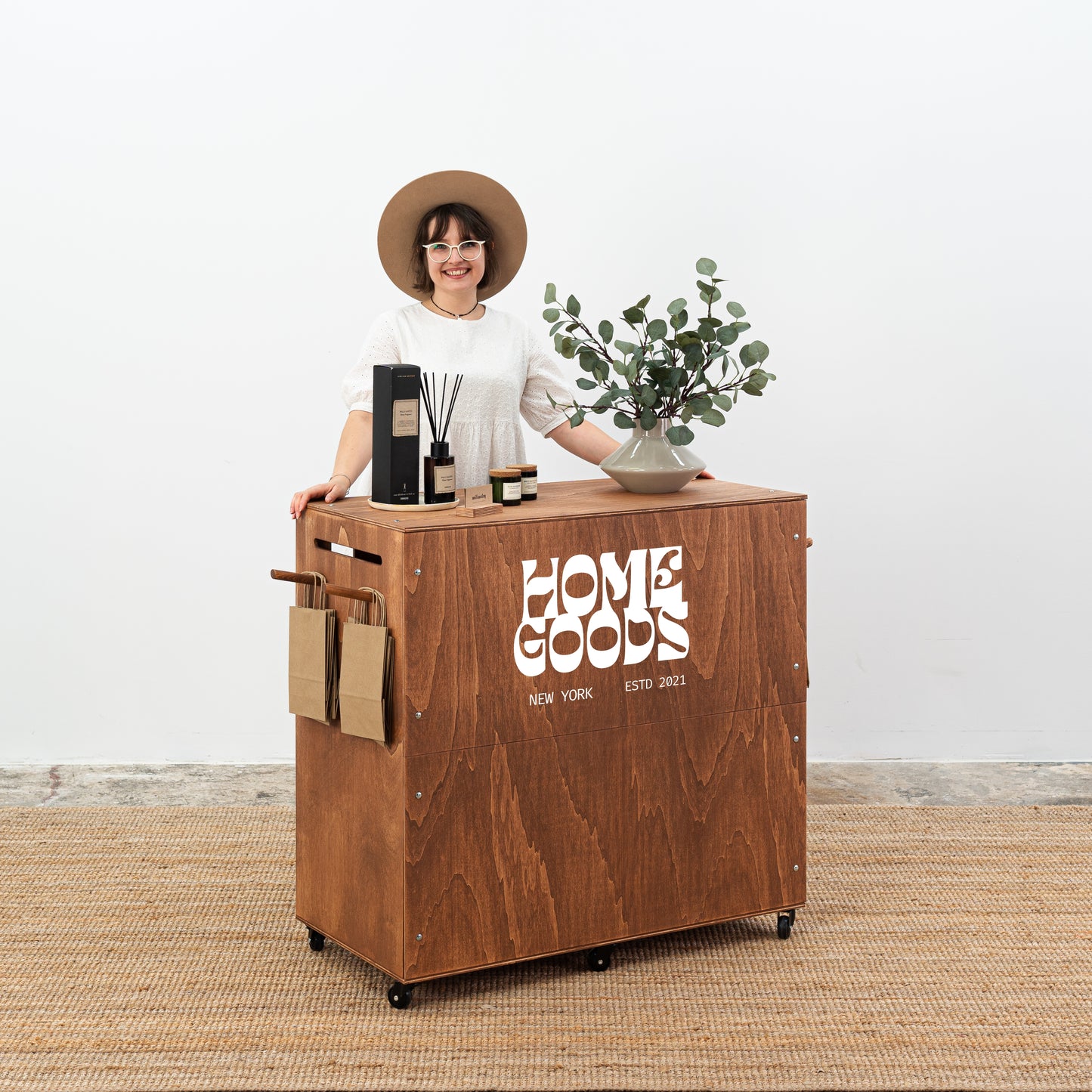Portable exhibition counter with lockable storage and customizable front panel.