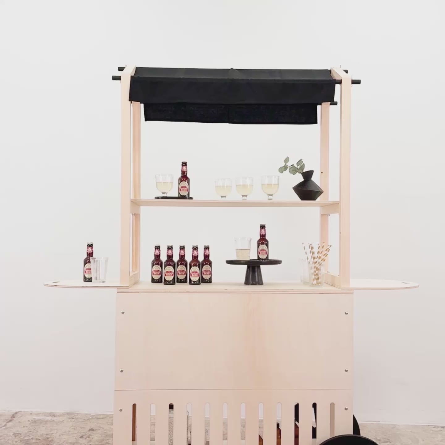 VC-11-W display cart in natural wood color, featuring a minimalist design with wooden shelves and customizable branding options.