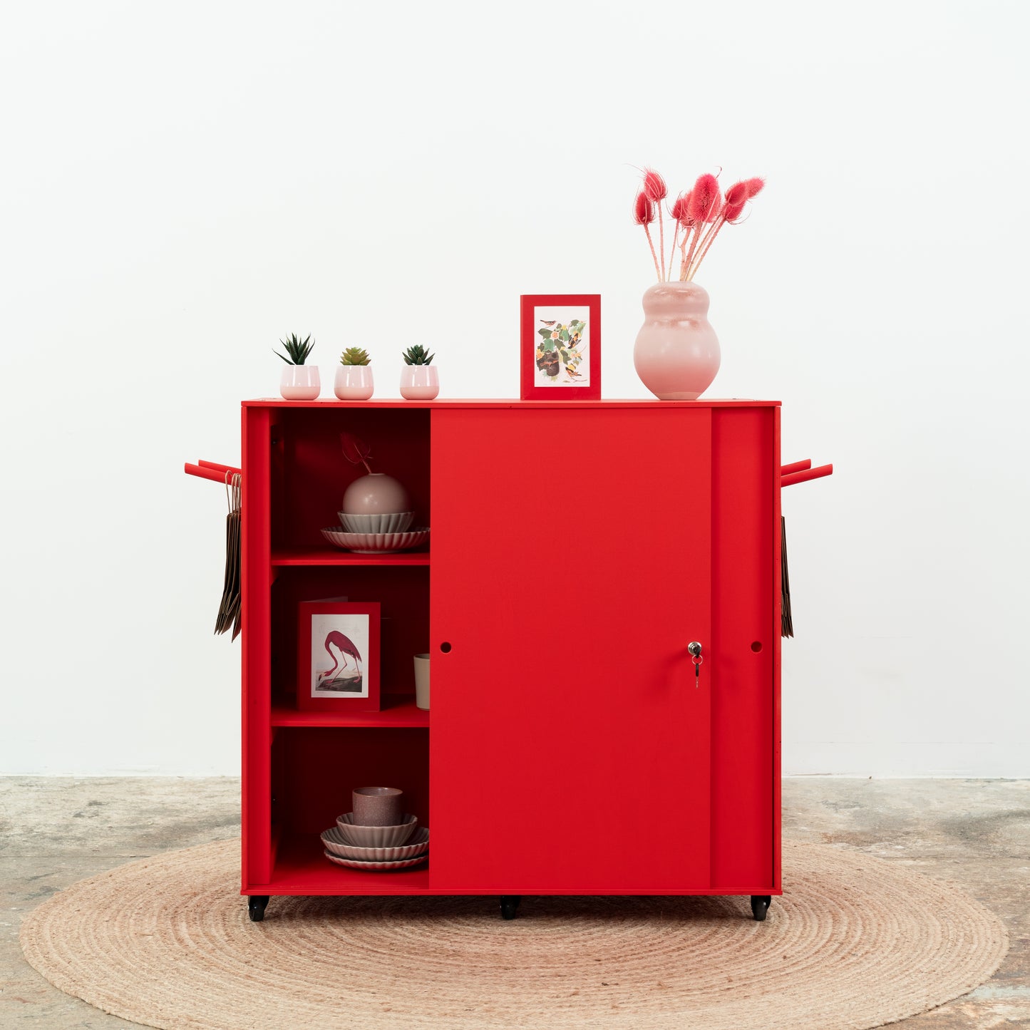 Red cashier counter with shelving and floral display