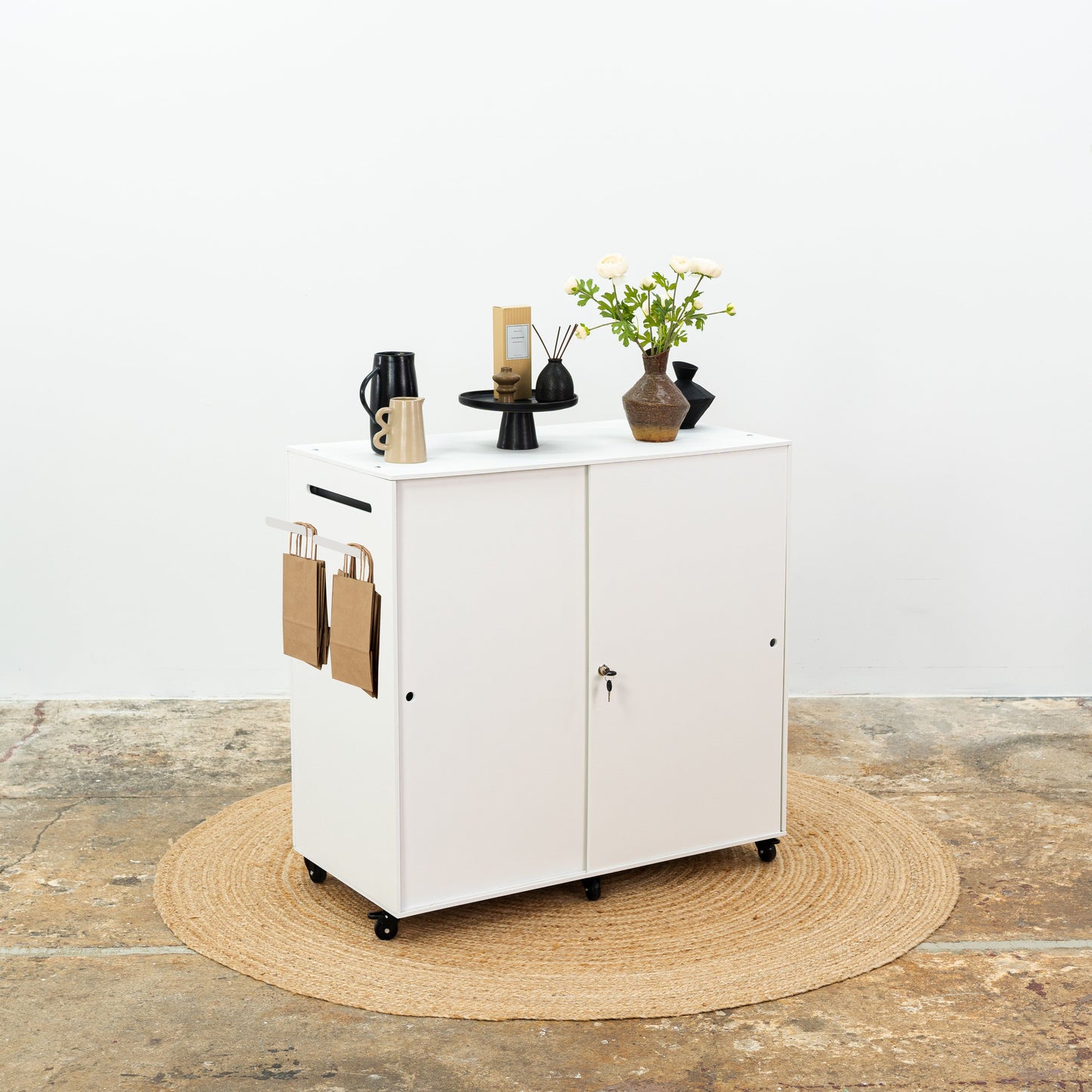 White retail counter with lockable wheels and personalization