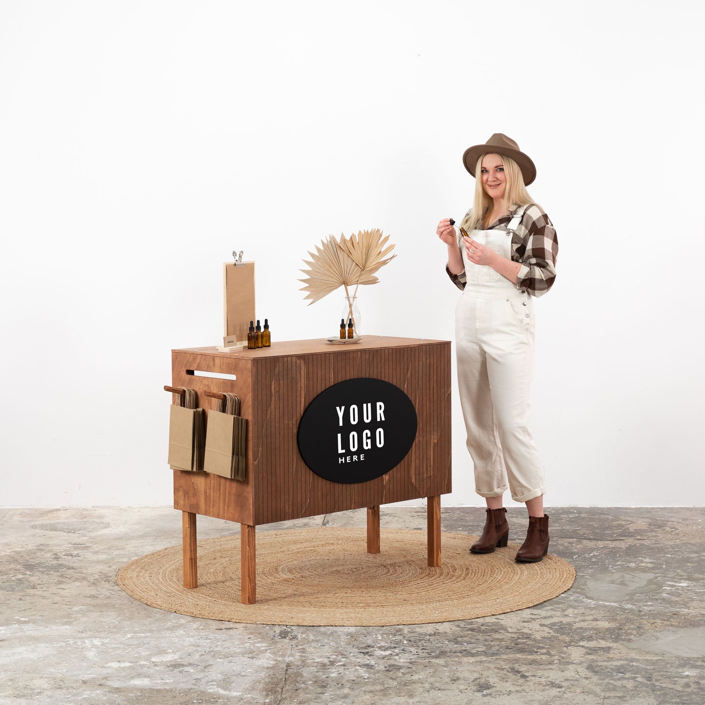 Coffee-colored wooden checkout counter with personalized logo panel