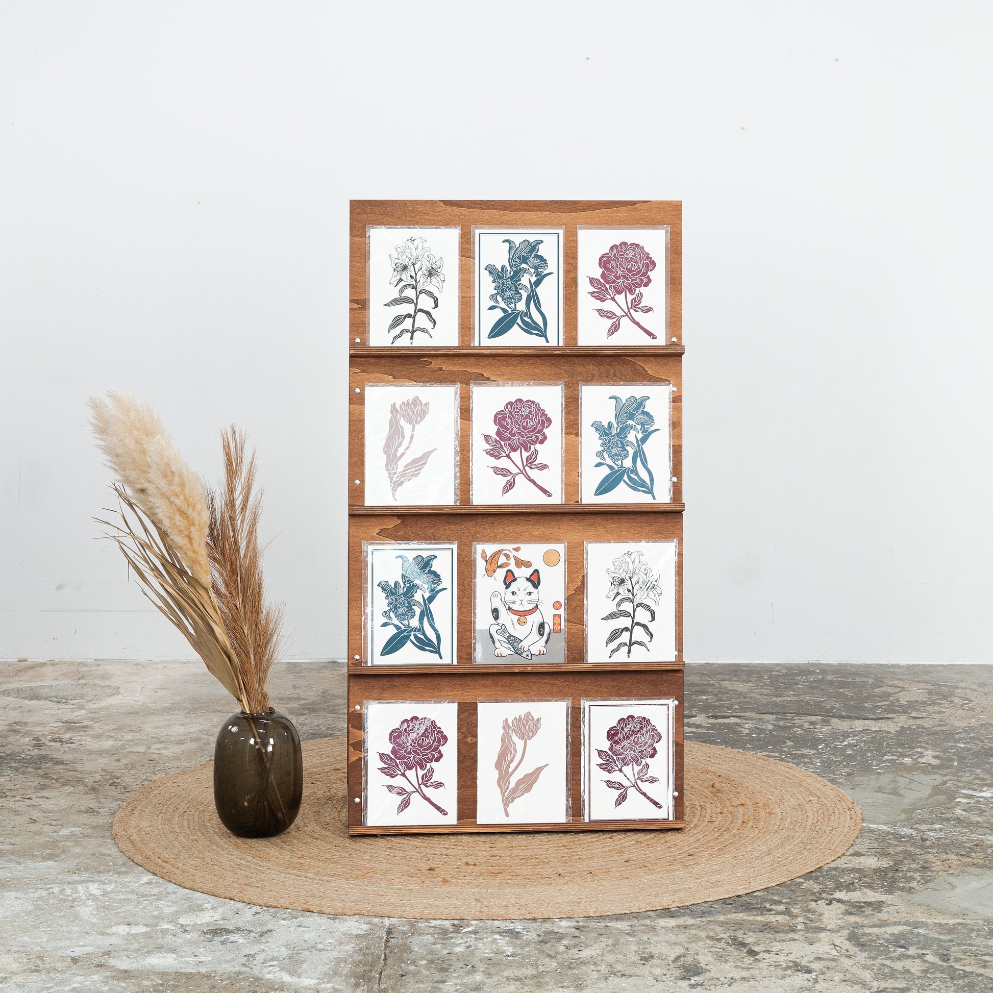 Foldable catalog stand in dark wood, front view with stacked brochures