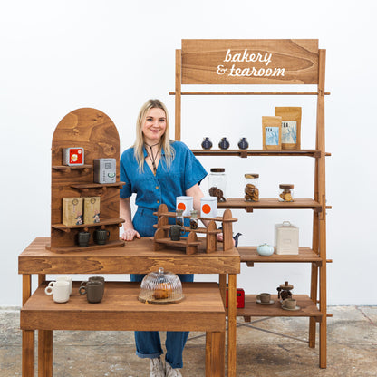 Modern booth design with display tables and wooden accessories