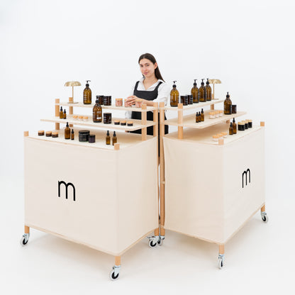 Wooden retail checkout unit placed in a trade show environment with lighting
