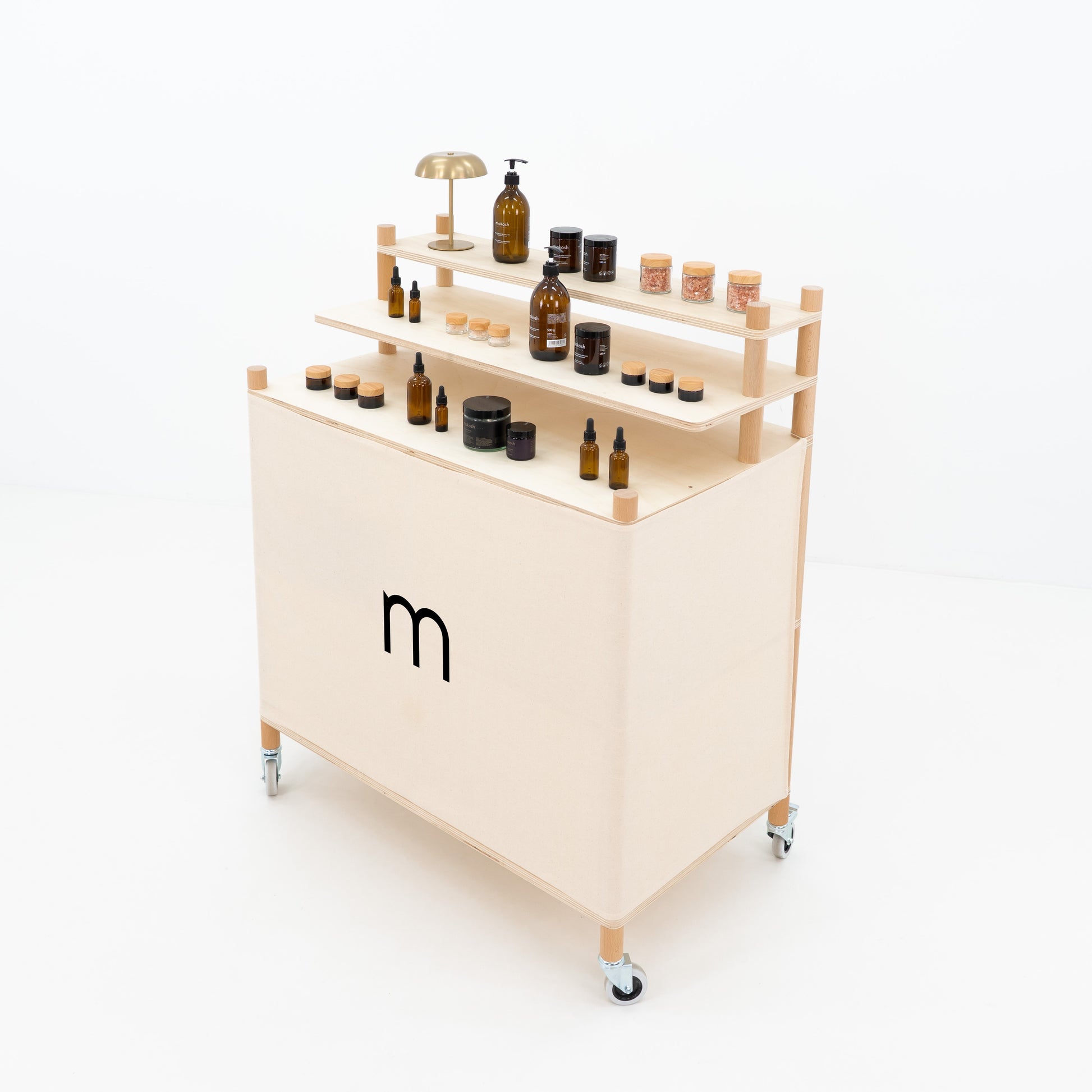 Side angle of portable checkout counter showing raised product shelves and rear storage space