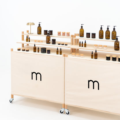 Pop-up market checkout counter with neutral canvas and minimalist layout
