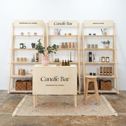 Modular retail display booth with checkout counter and shelves

