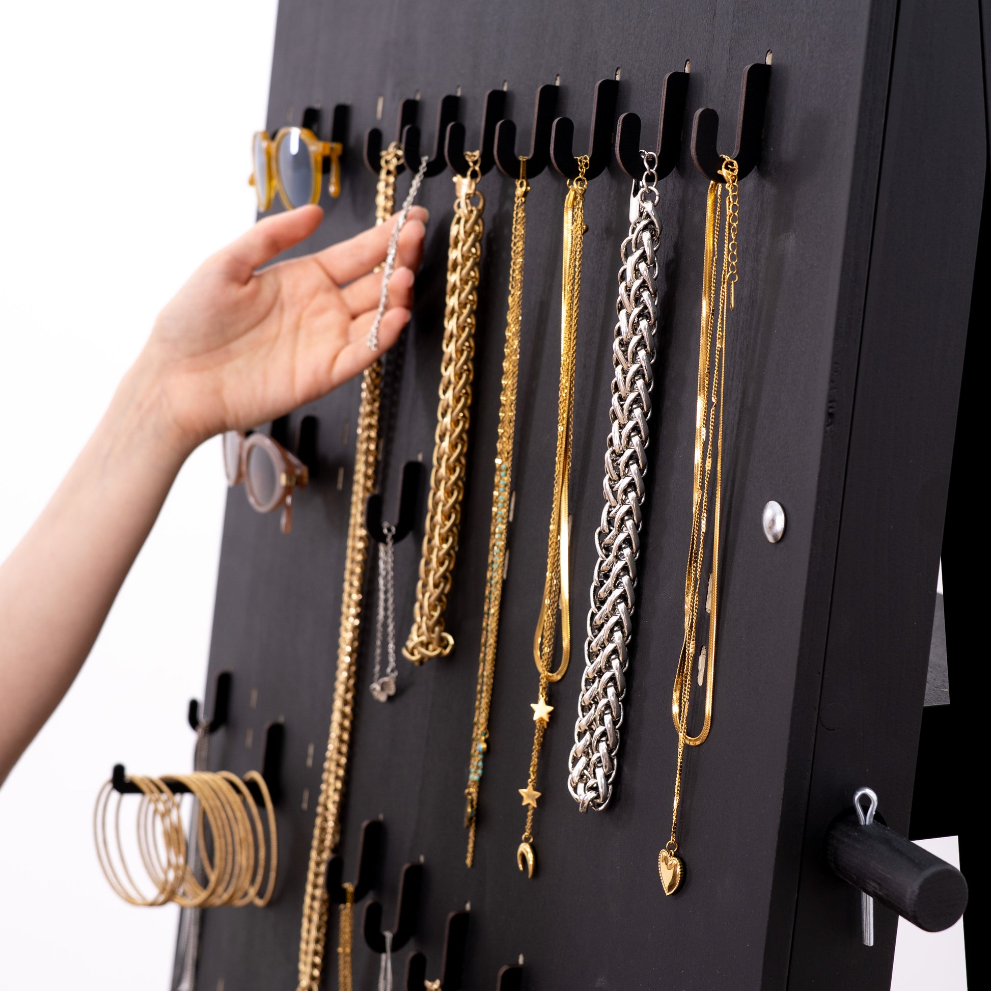 Durable black short hooks for pegboards, offering a stylish and functional solution for retail displays and event setups.