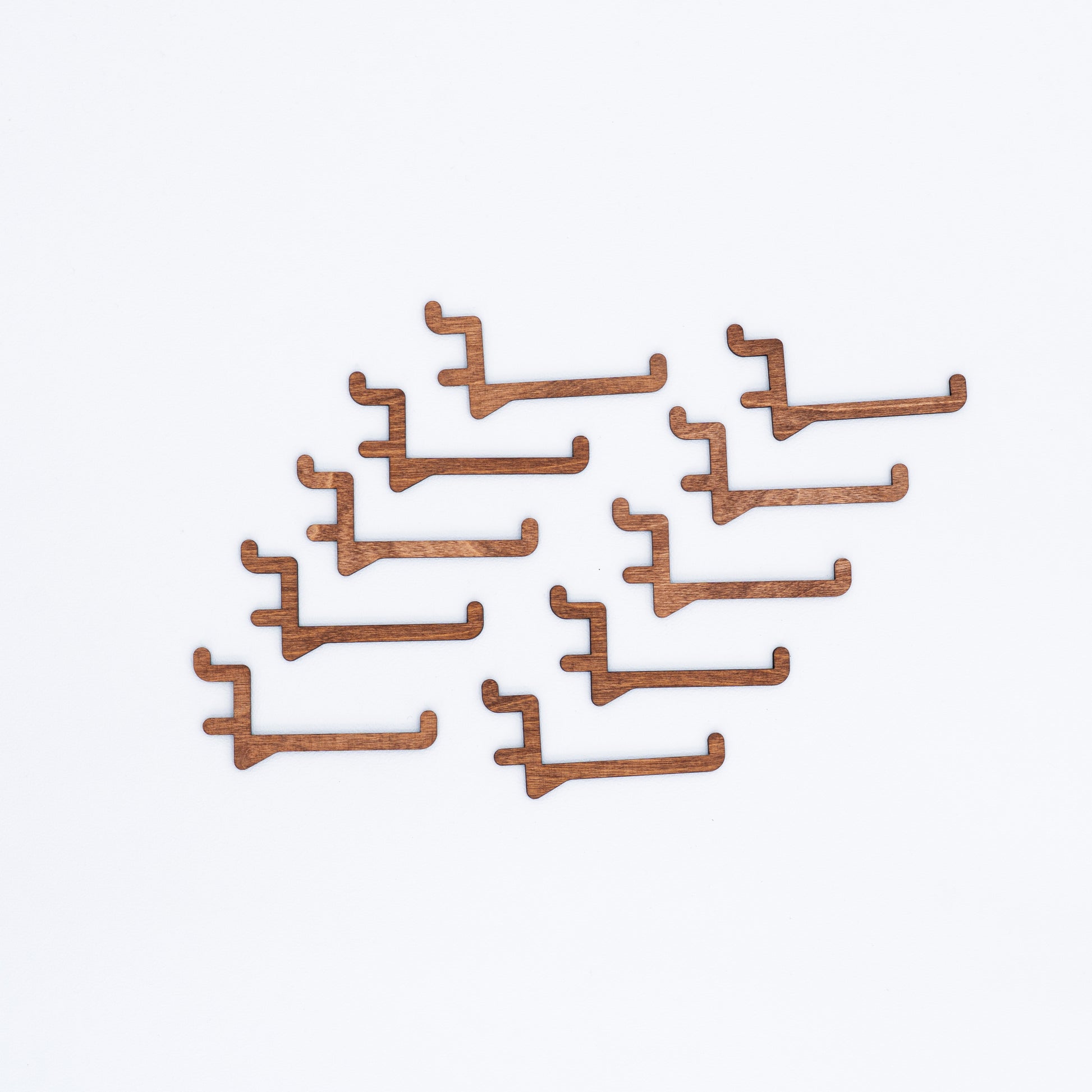 Coffe color long hooks for pegboards, perfect for hanging larger items like apparel and bags in retail and event displays.
