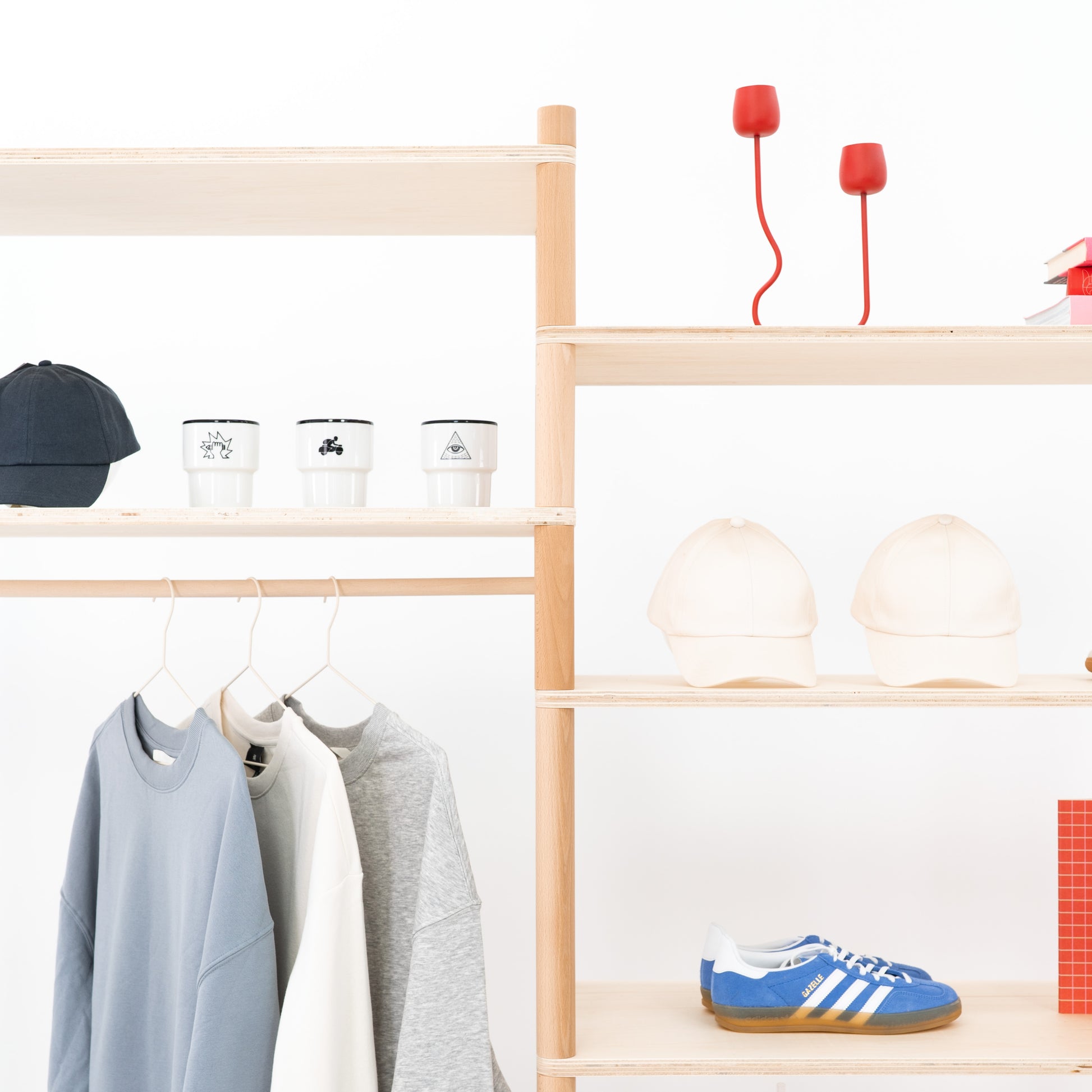 Minimalist wooden merchandising shelf with three panels