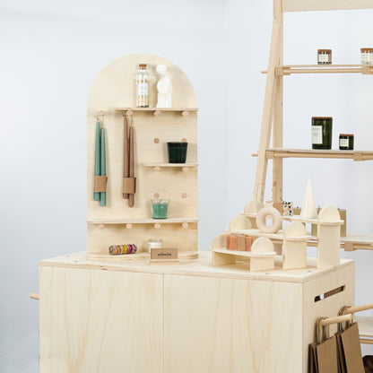 Pegboard close-up showing hooks and display accessories


