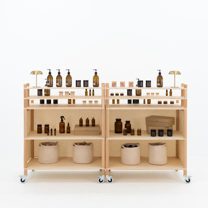 Craft fair display stand with elevated product tiers and compact base
