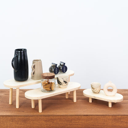 Set of 3 wooden risers for product display in artisan boutique

